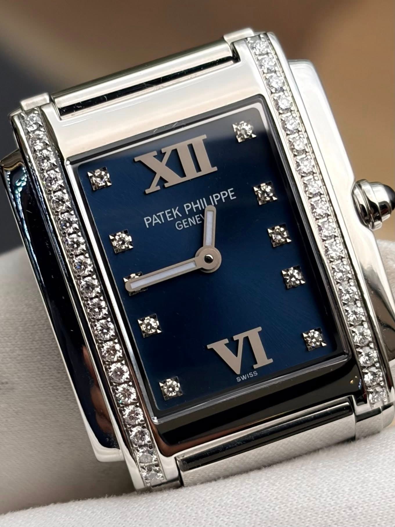 May be an image of wrist watch and text that says 'X PATEKPHILIPPE PATEK PHIL PHILIPPE IPPE PATEK GENE SWISS'