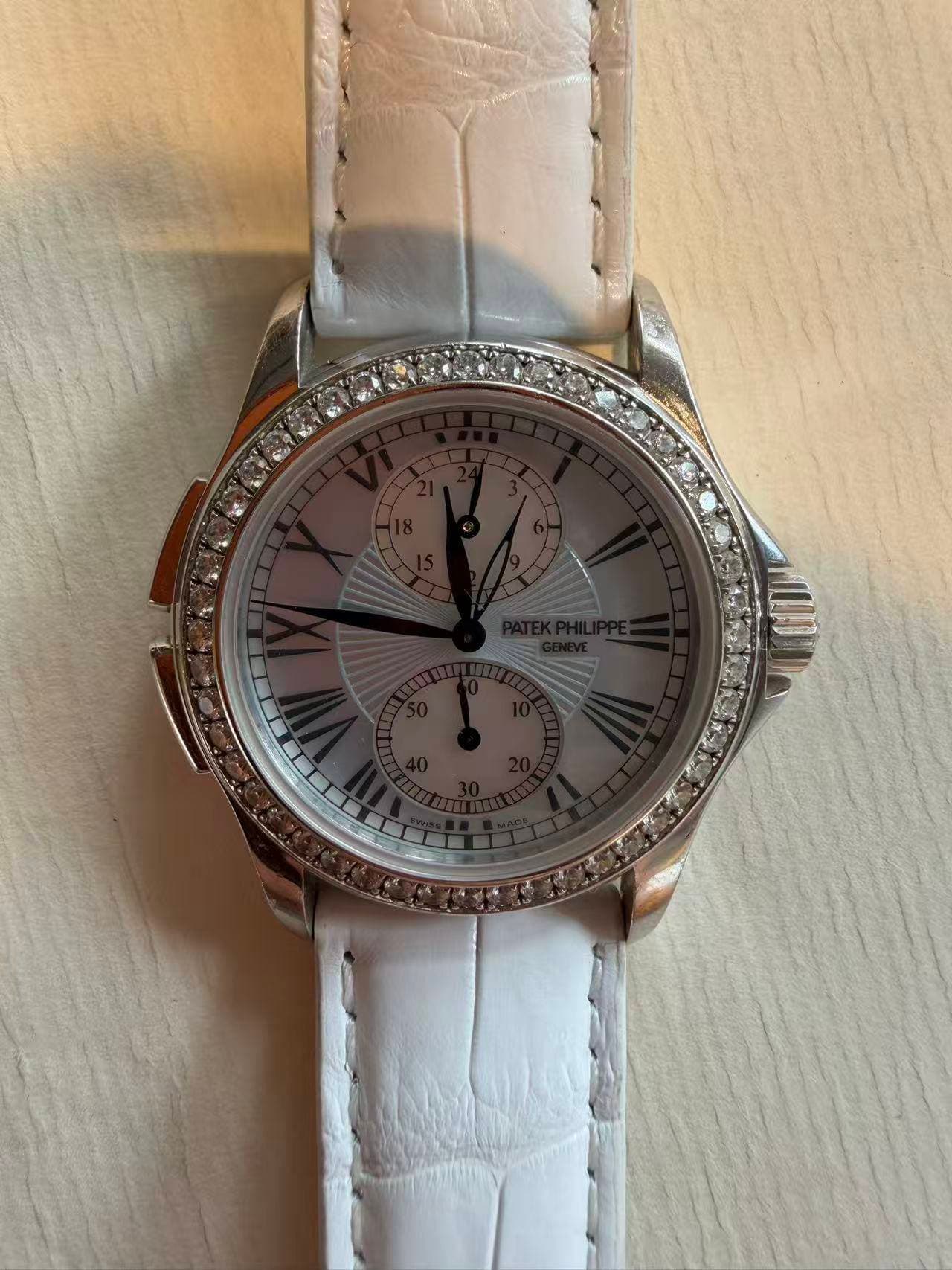 May be an image of wrist watch and text
