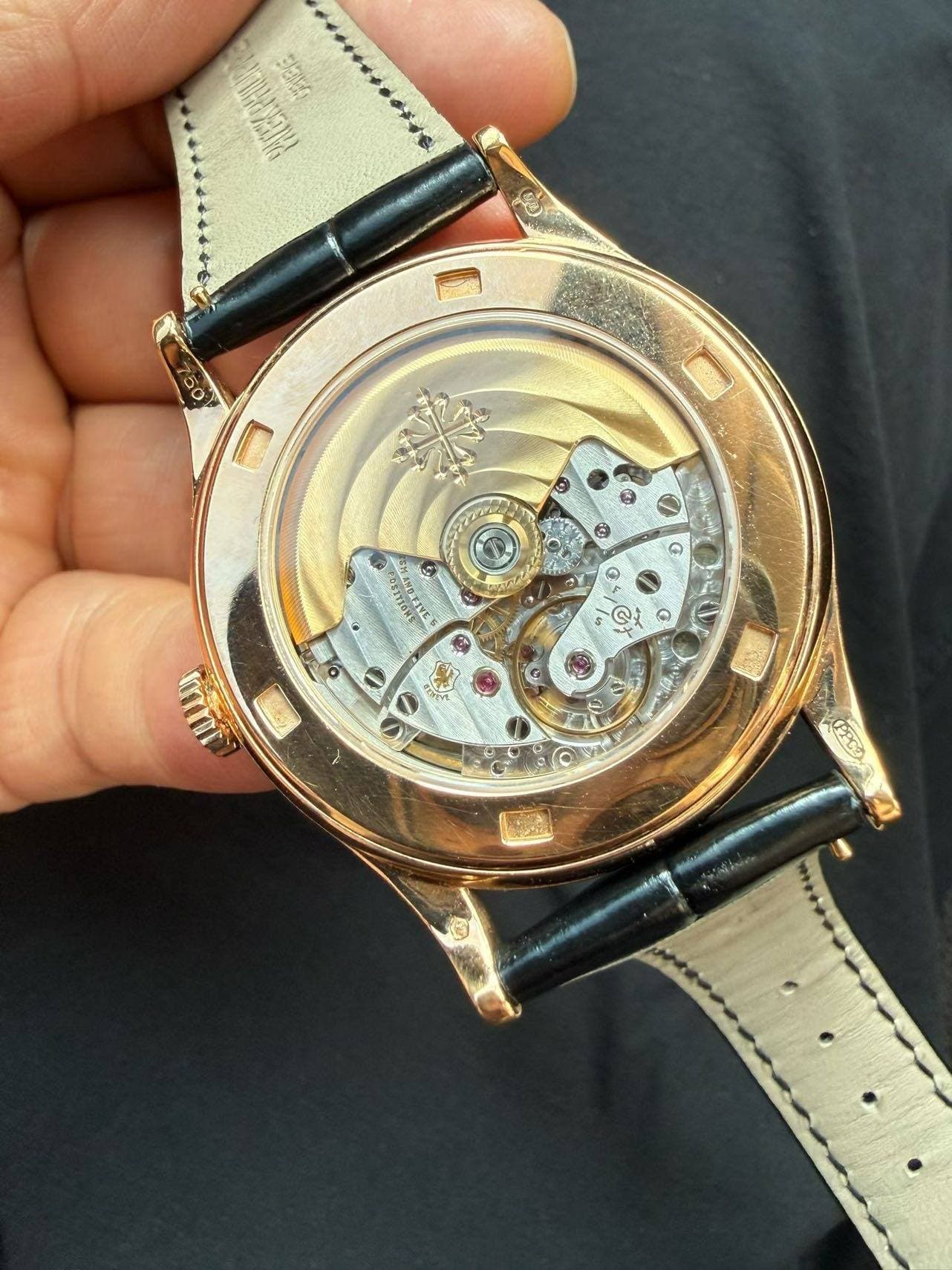 May be an image of wrist watch and text