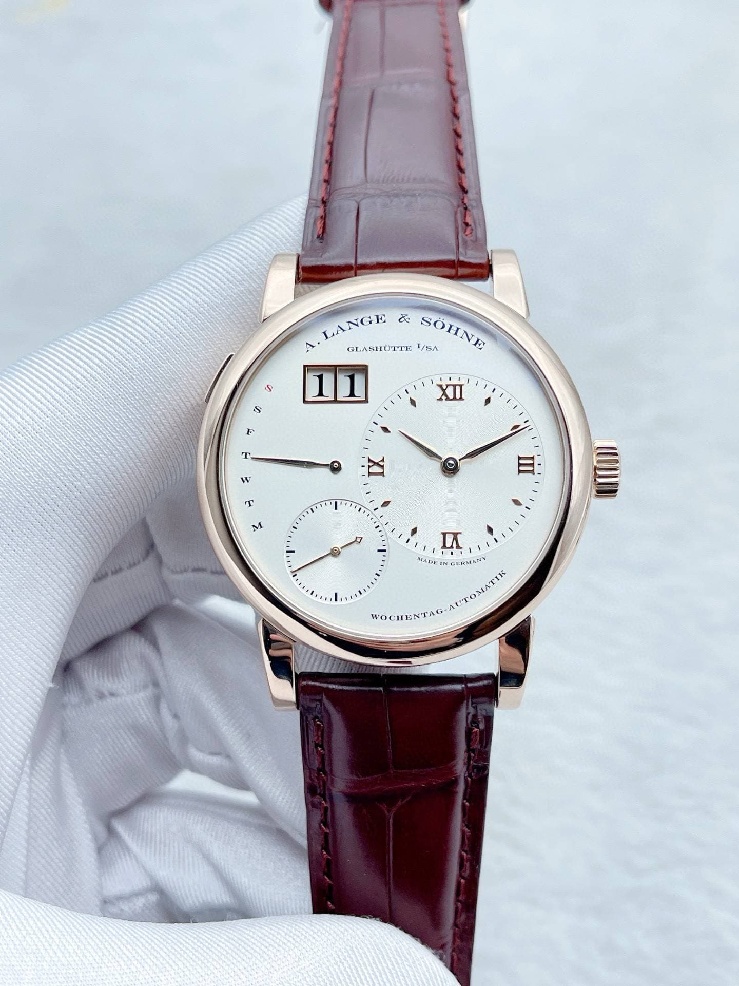 May be an image of wrist watch and text