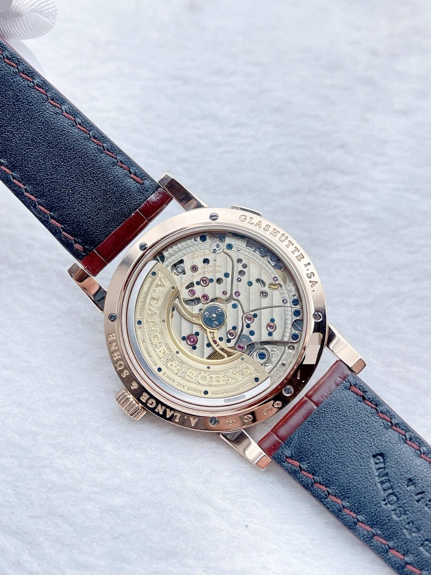 May be an image of wrist watch and text