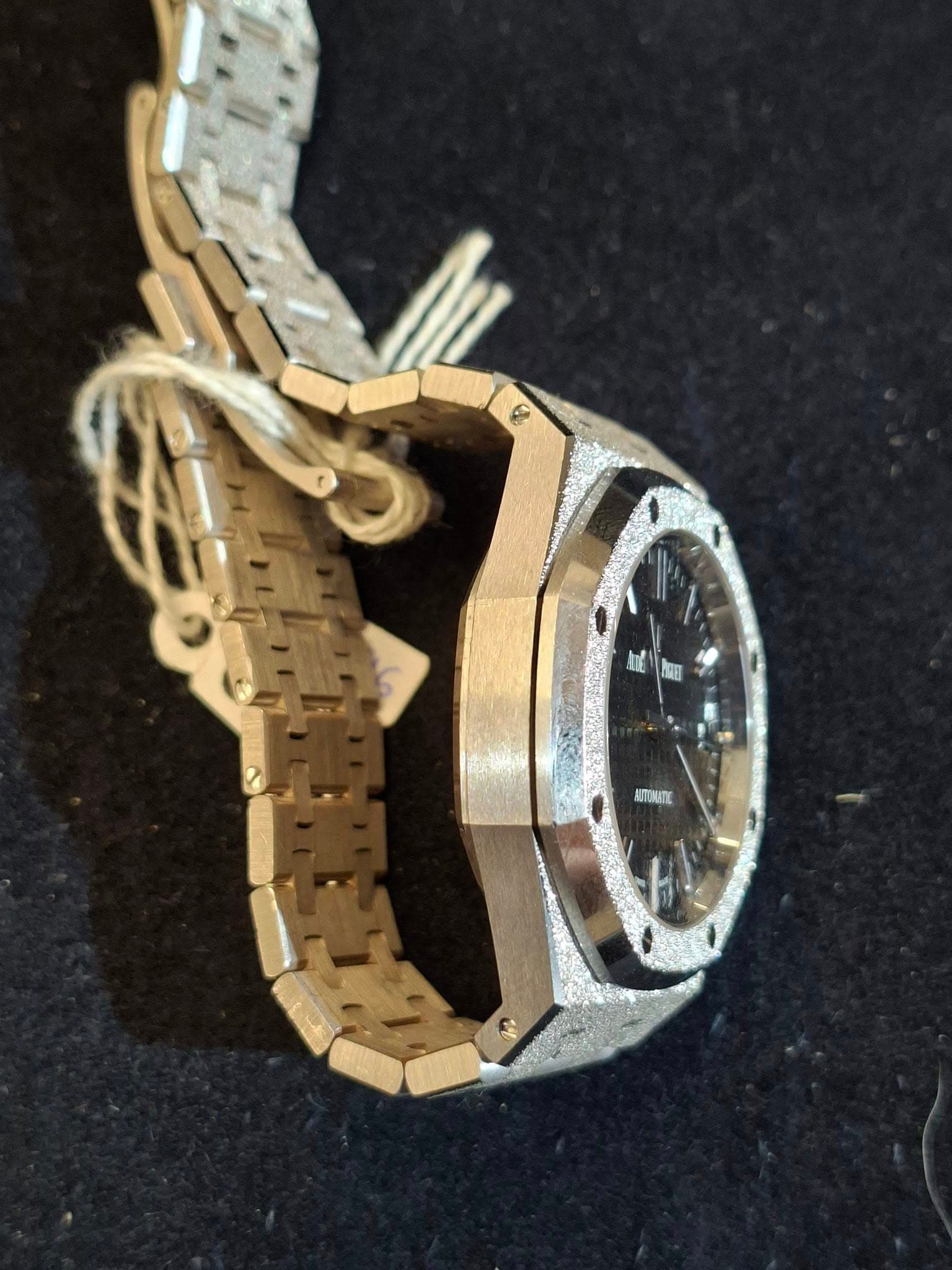 May be an image of wrist watch and text