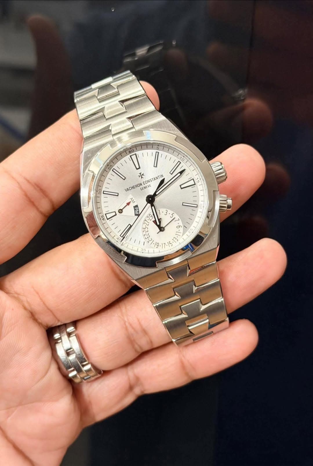 May be an image of wrist watch and text