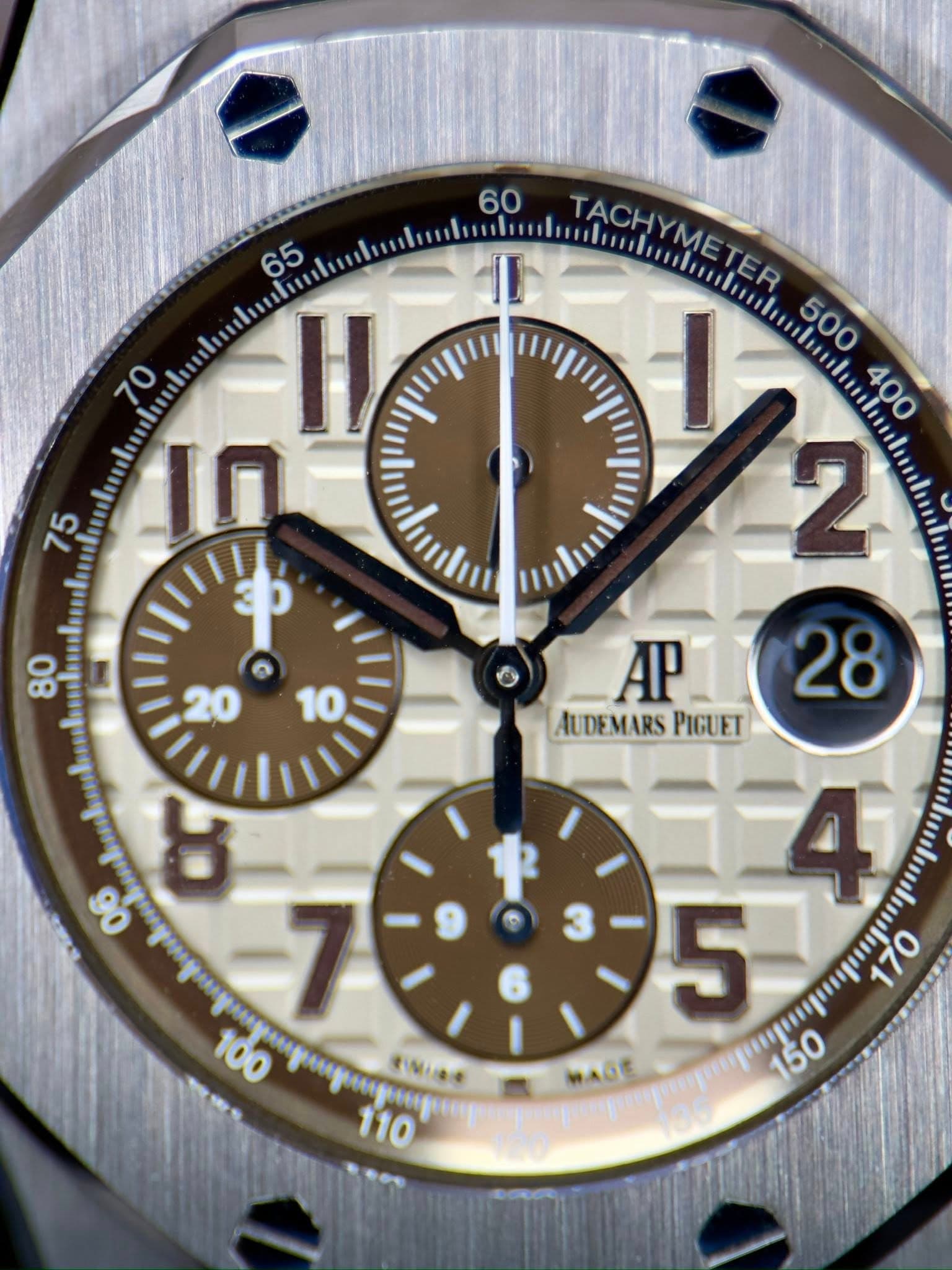 May be an image of wrist watch and text that says '65 70 H 10 hih 75 60 TACHYMETER TAGHNMETER TACH TAChmn/u/on... I AP28 28 AP AUDEMARS PIGUET きMみ 10 5 0 WAGE P 150'