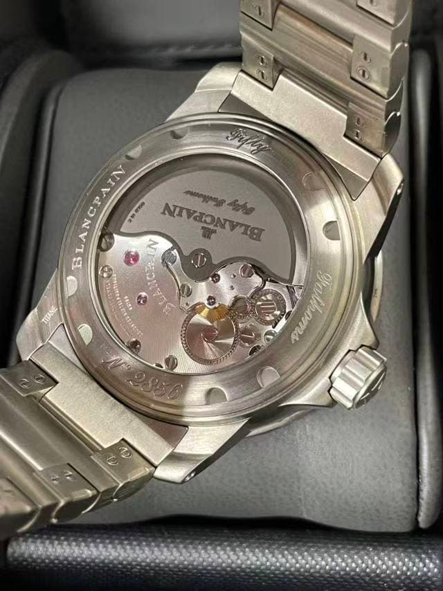 May be an image of digital watch and text that says 'ANCPAIN BLANCPAIN VIN 250000 NIVJON NVC ብምግሐሔ መበማስማይሽብ LAN N 6 + HETEL TITANE TB'