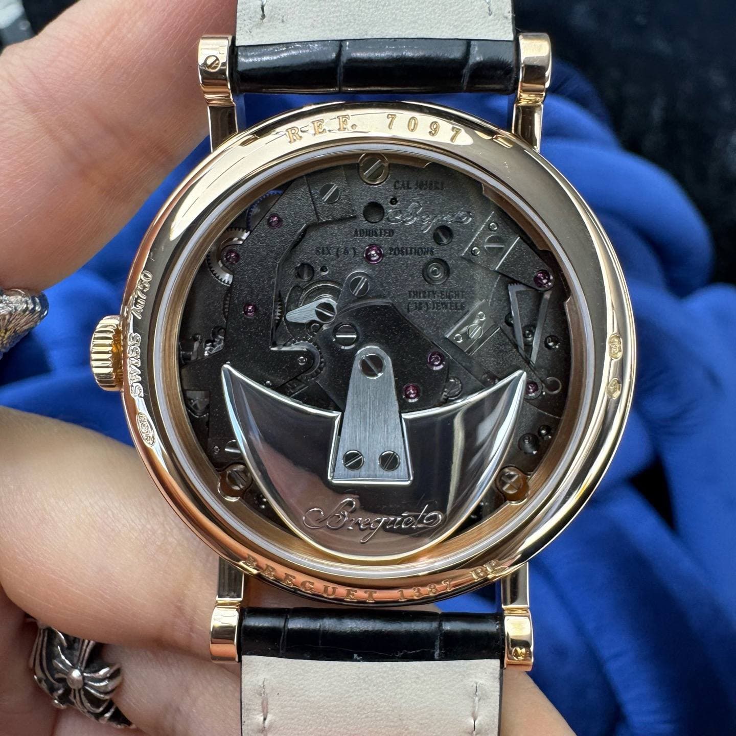 May be an image of wrist watch and text