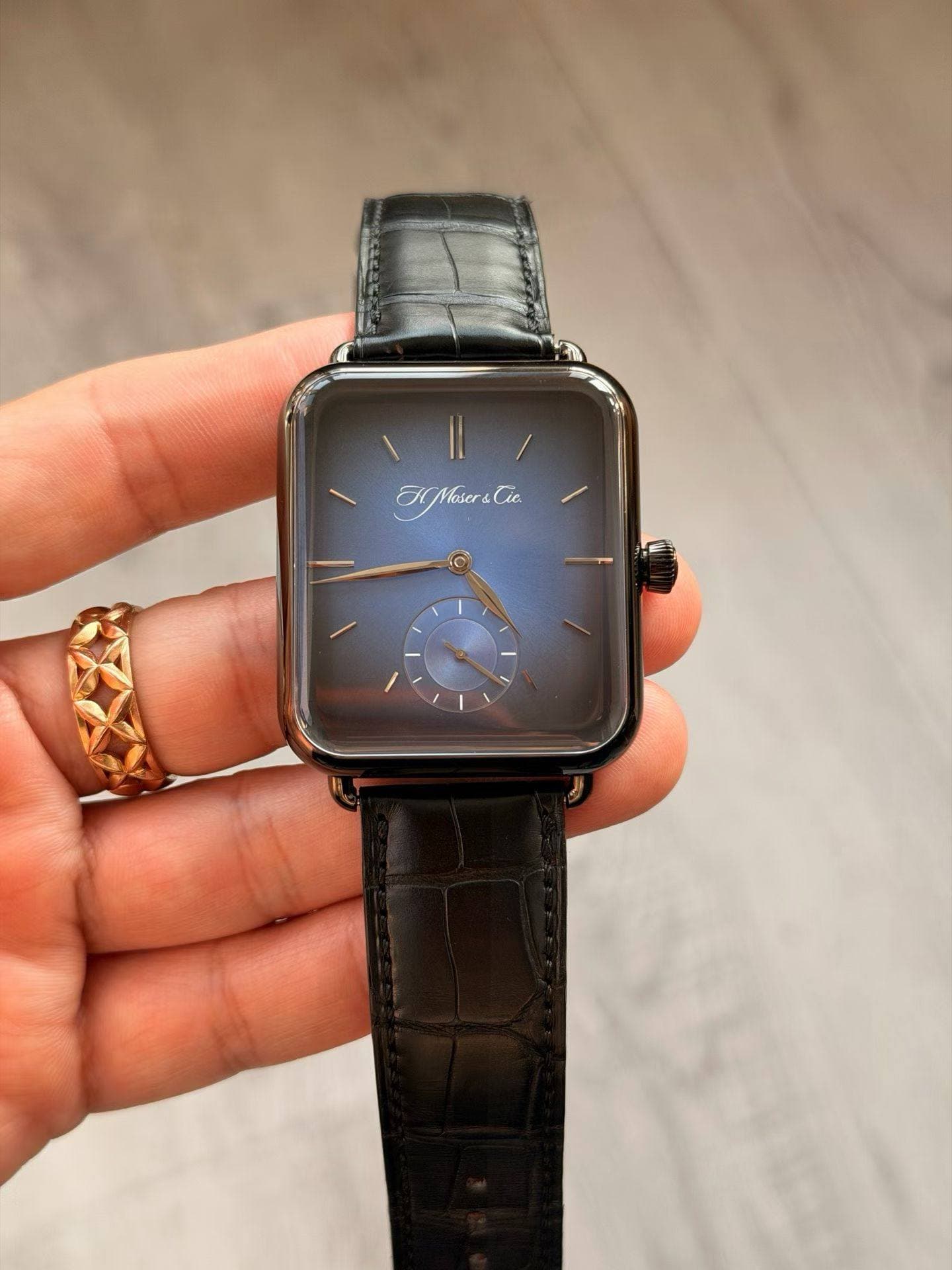 May be an image of wrist watch and text that says 'EMMoser&Cie'
