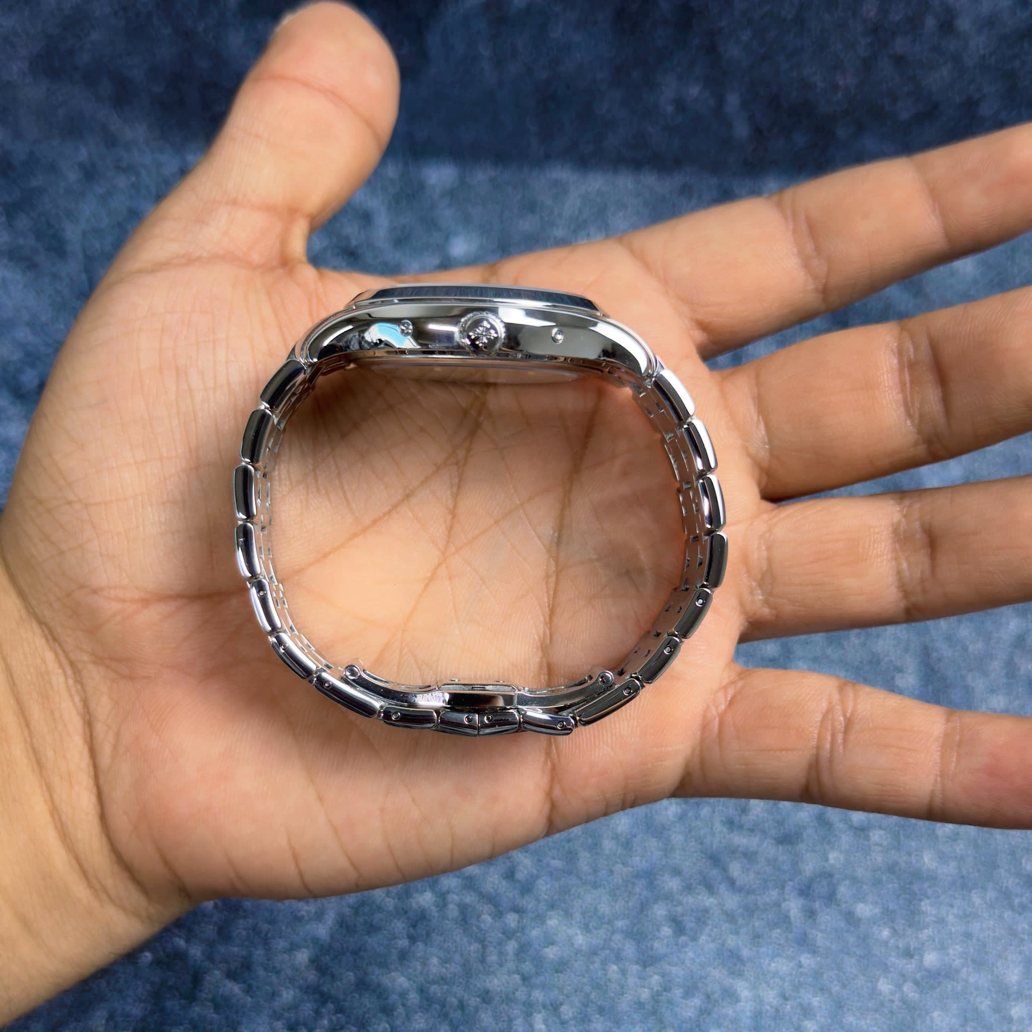 May be an image of wrist watch and ring