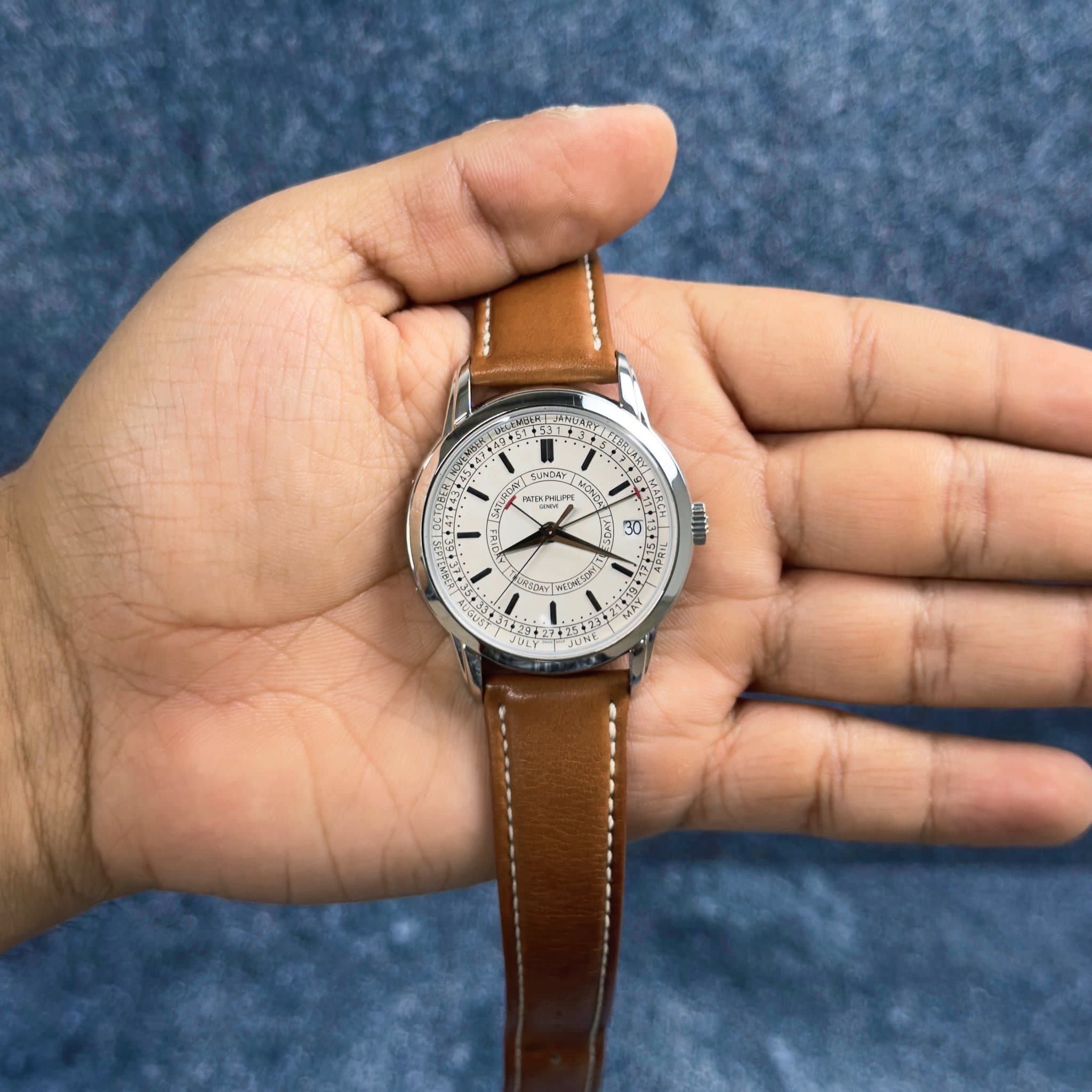 May be an image of wrist watch and text