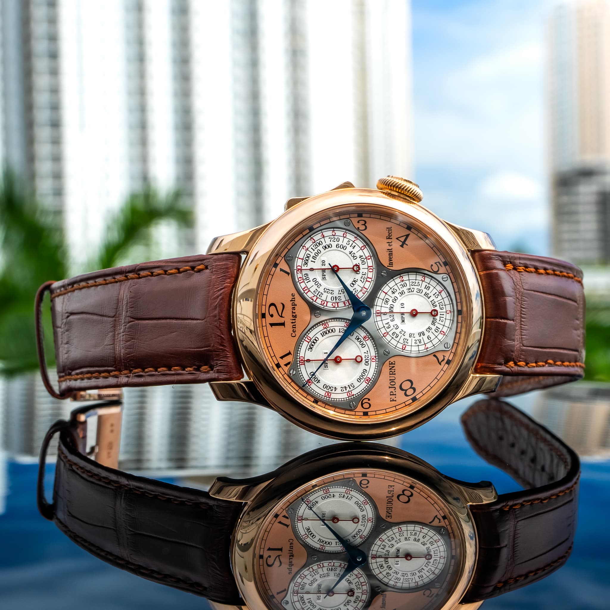 May be an image of wrist watch and text