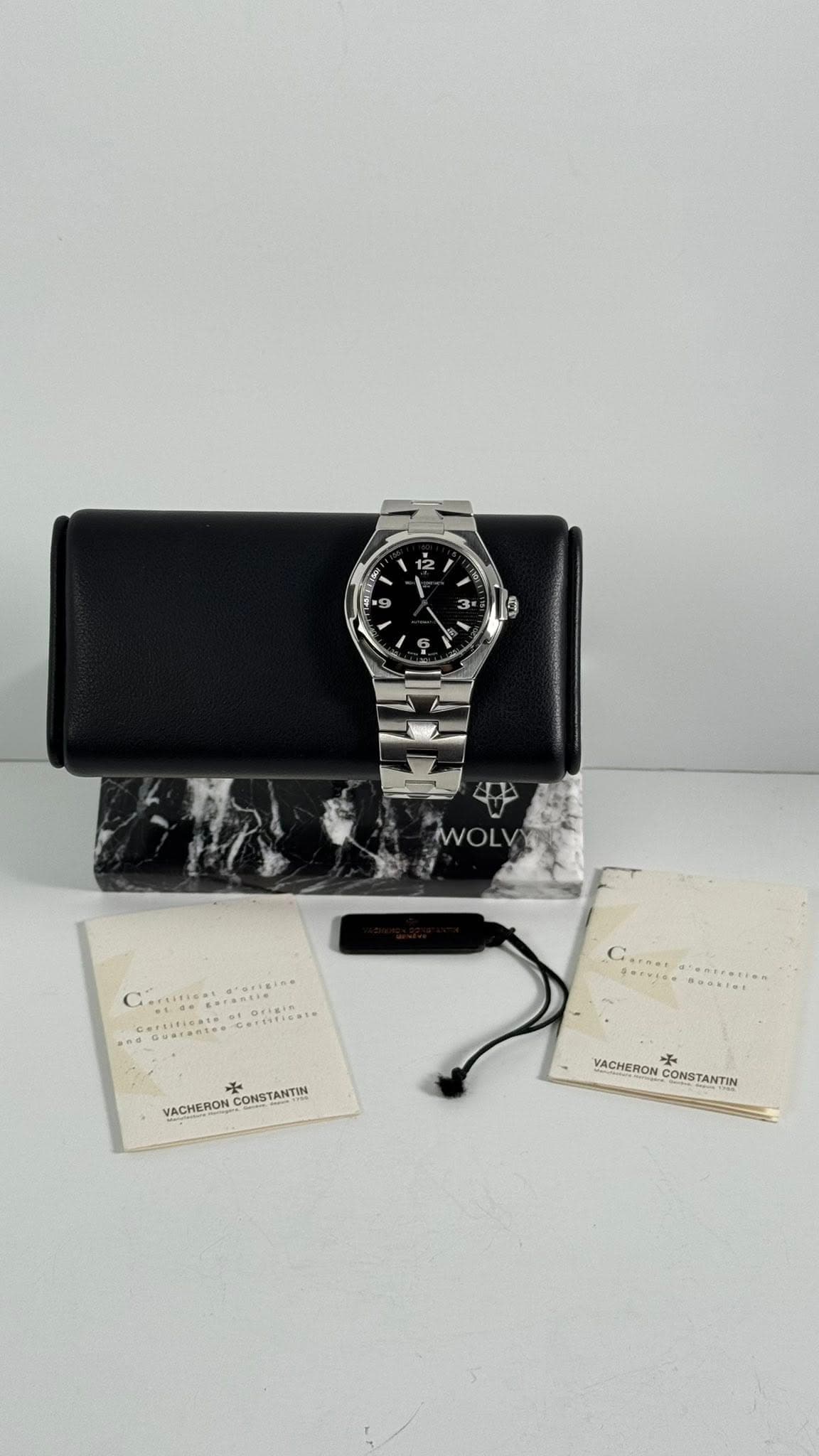 May be an image of wrist watch and text