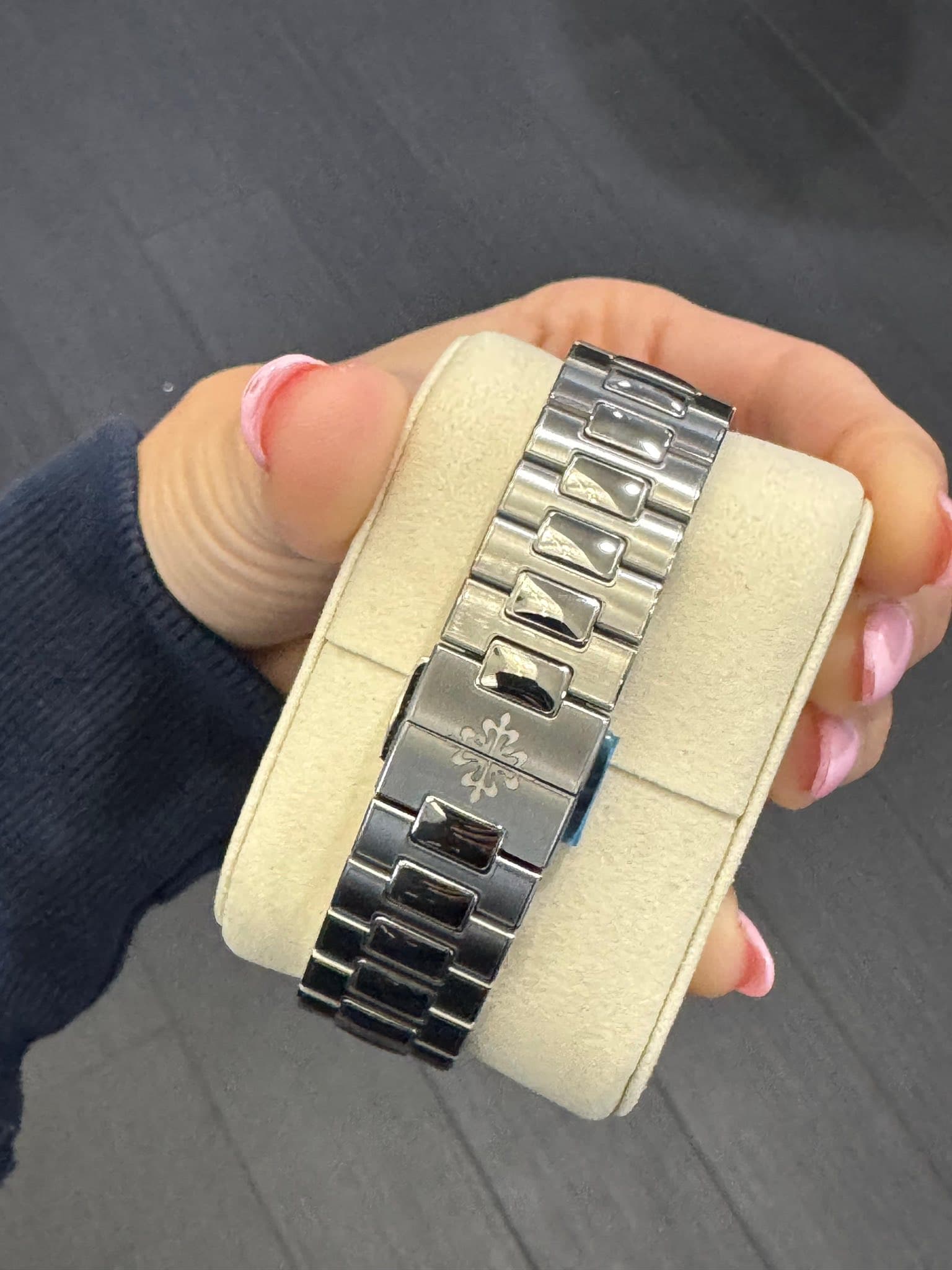 May be an image of wrist watch and text