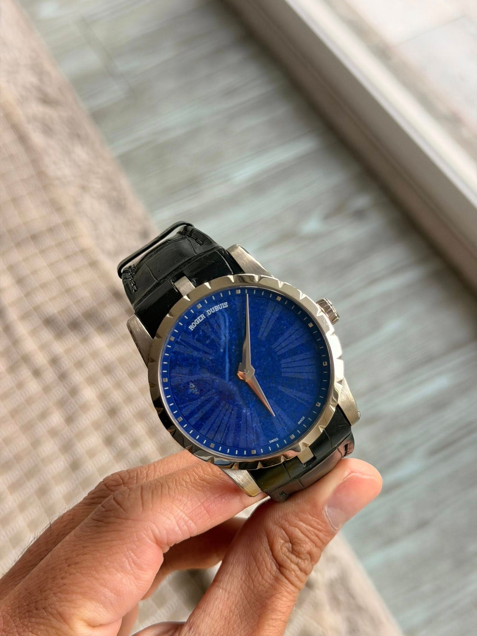 May be an image of digital watch and text that says 'DUBUIS ROGER'