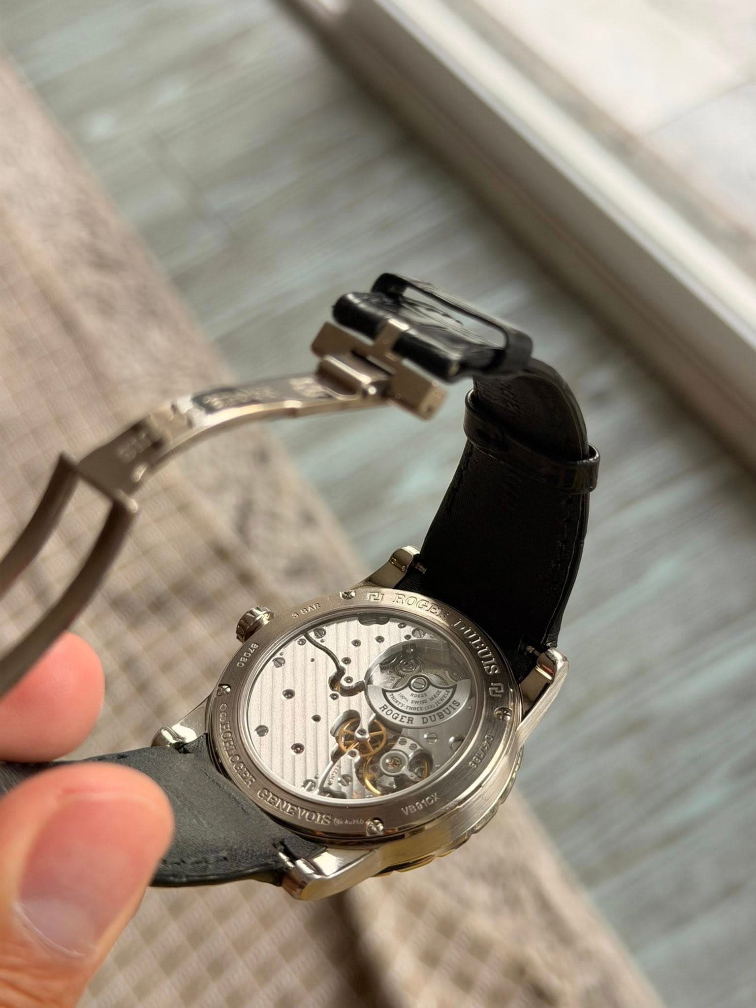 May be an image of wrist watch and text