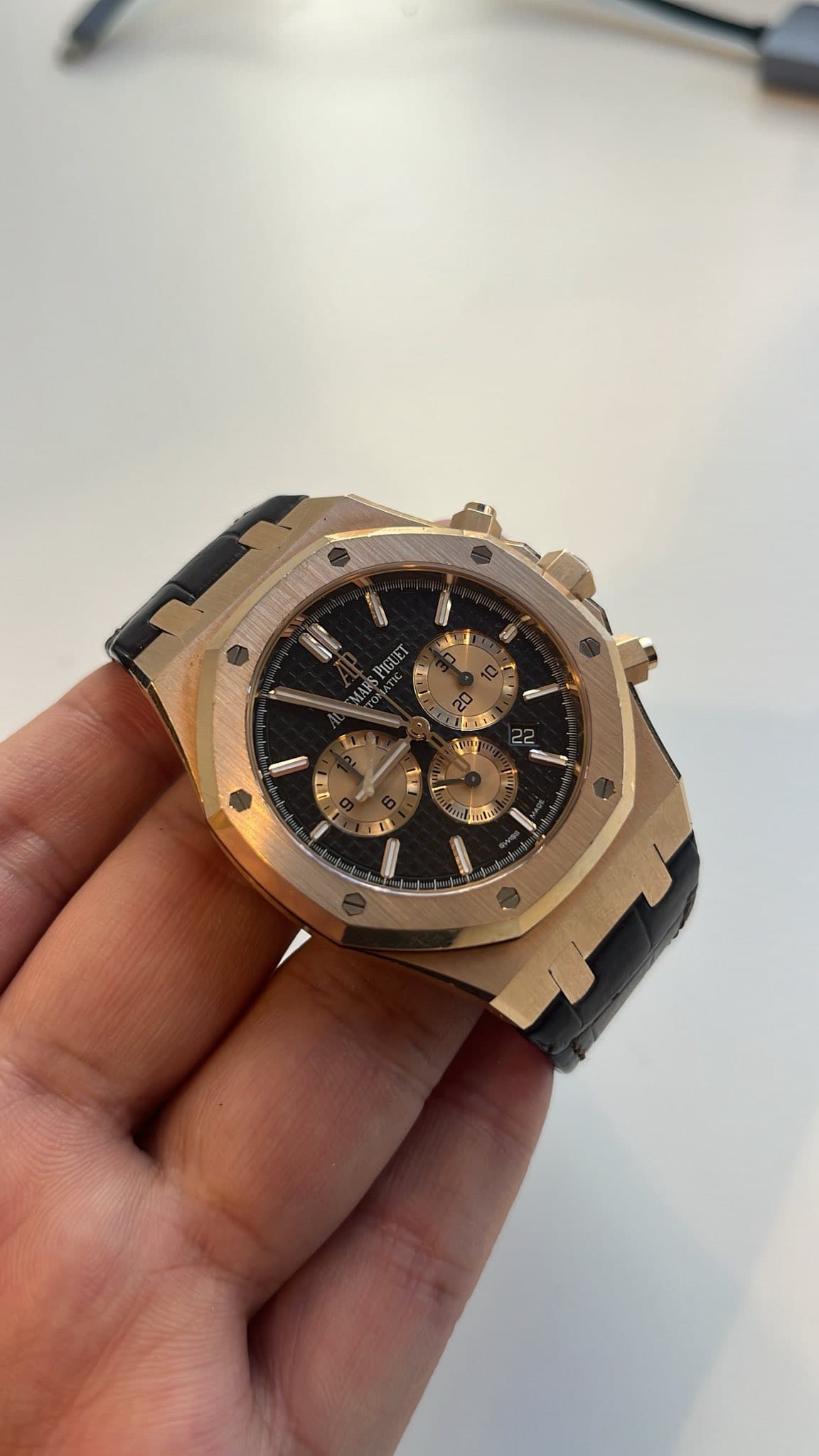 May be an image of wrist watch and text