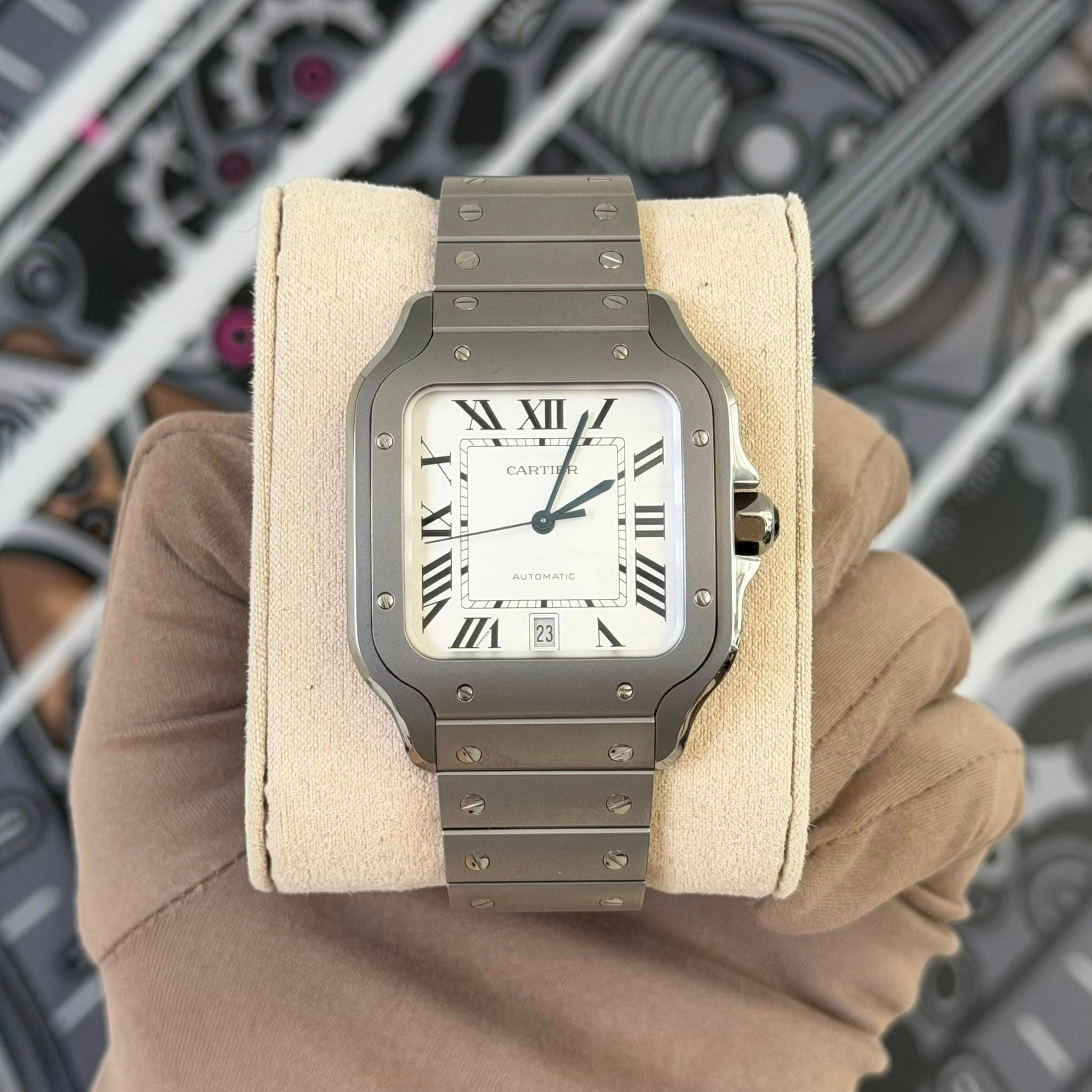 May be an image of wrist watch and text that says 'e ၁ จ XI XIXIII I XI Σиж CARTIE e AUTOMATIC IX 2 III /1 電區 23 III III e N'