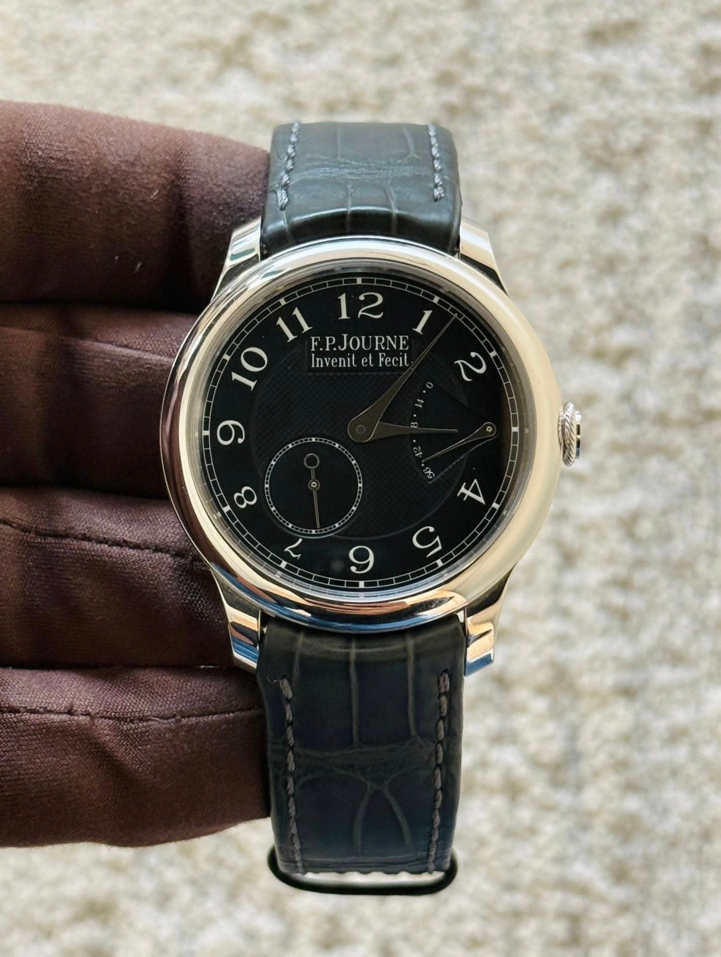 May be an image of wrist watch and text that says '11 F.P.JOURNE F.P.JOU RNE 12 1 Invenit InvenitelFecit elFecit ב 一 9 ထ 6 チ C 9'