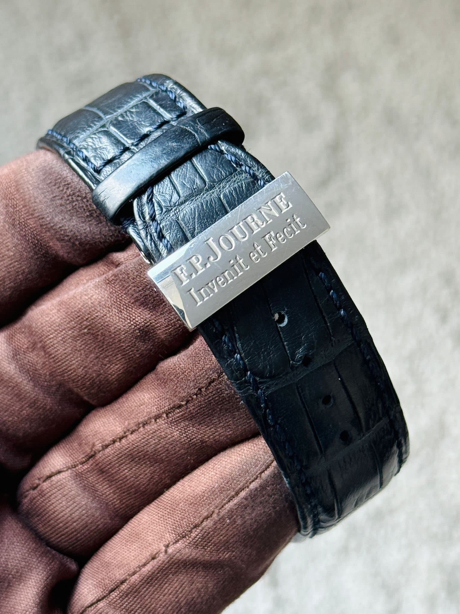 May be an image of leather, saddle-stitched leather, wrist watch and text