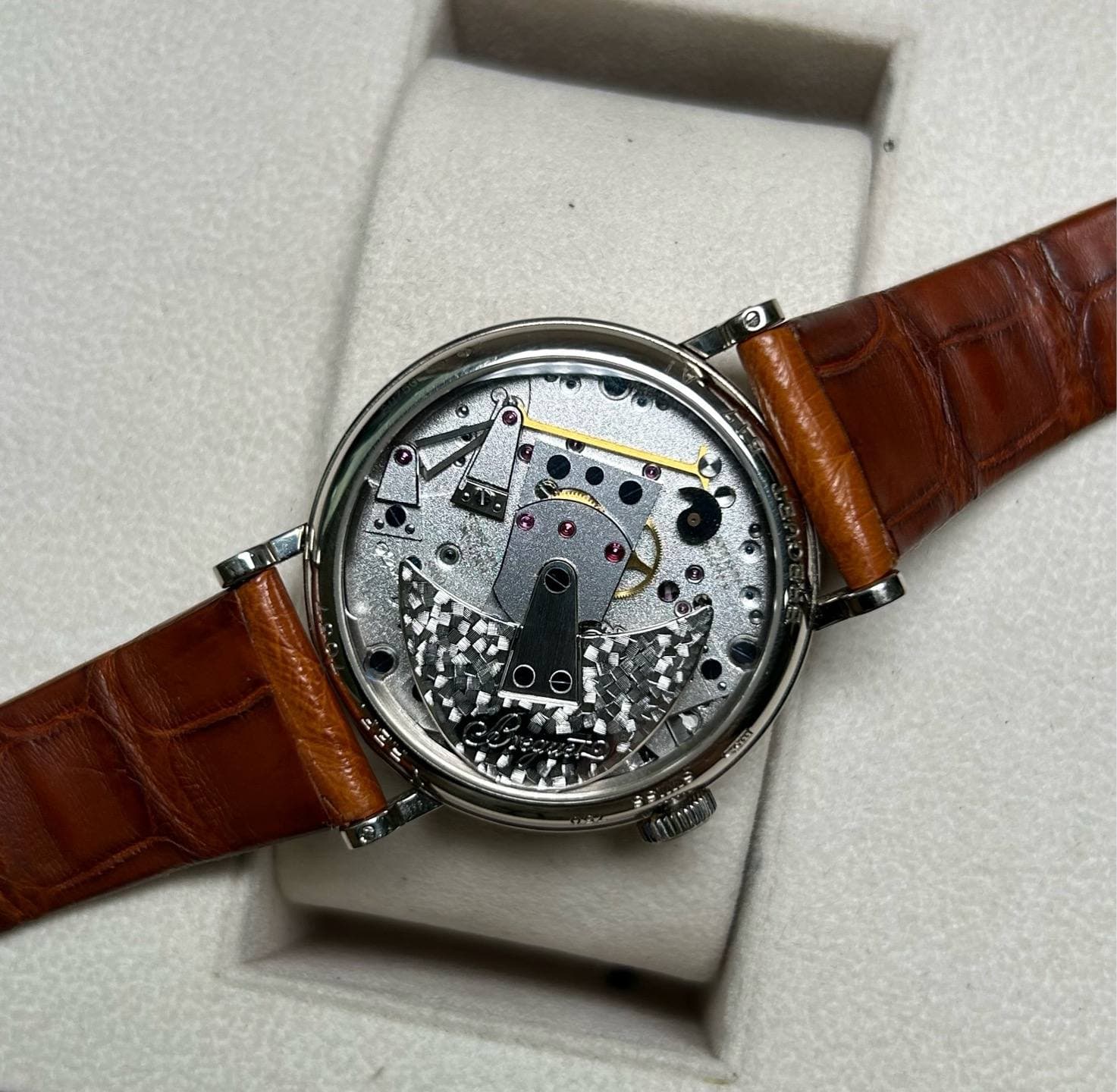 May be an image of wrist watch and text