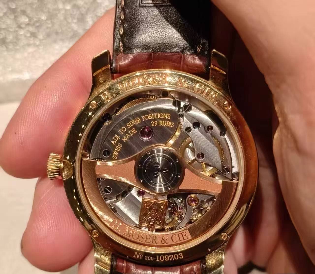 May be an image of wrist watch and text