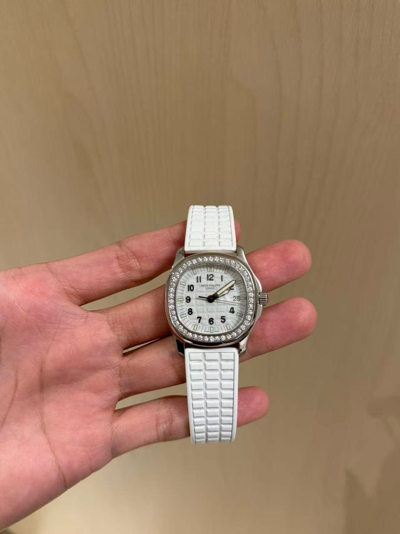 May be an image of wrist watch and text