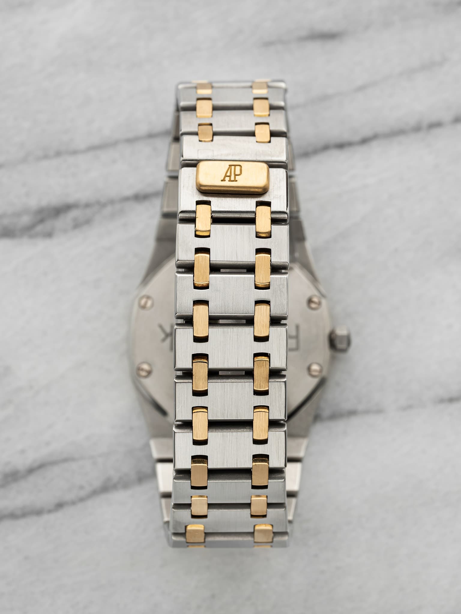 May be an image of wrist watch and text that says 'AP'