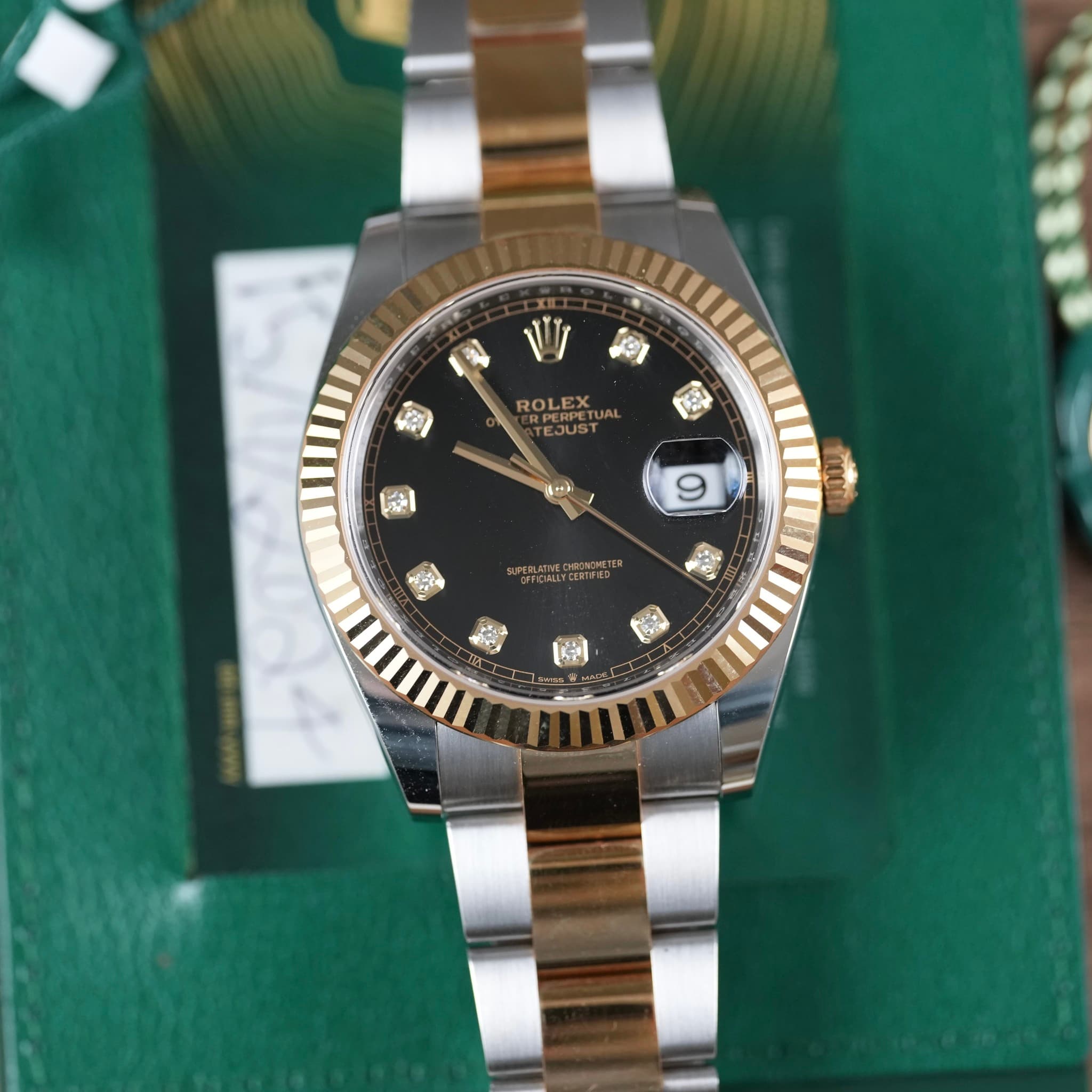 May be an image of wrist watch and text