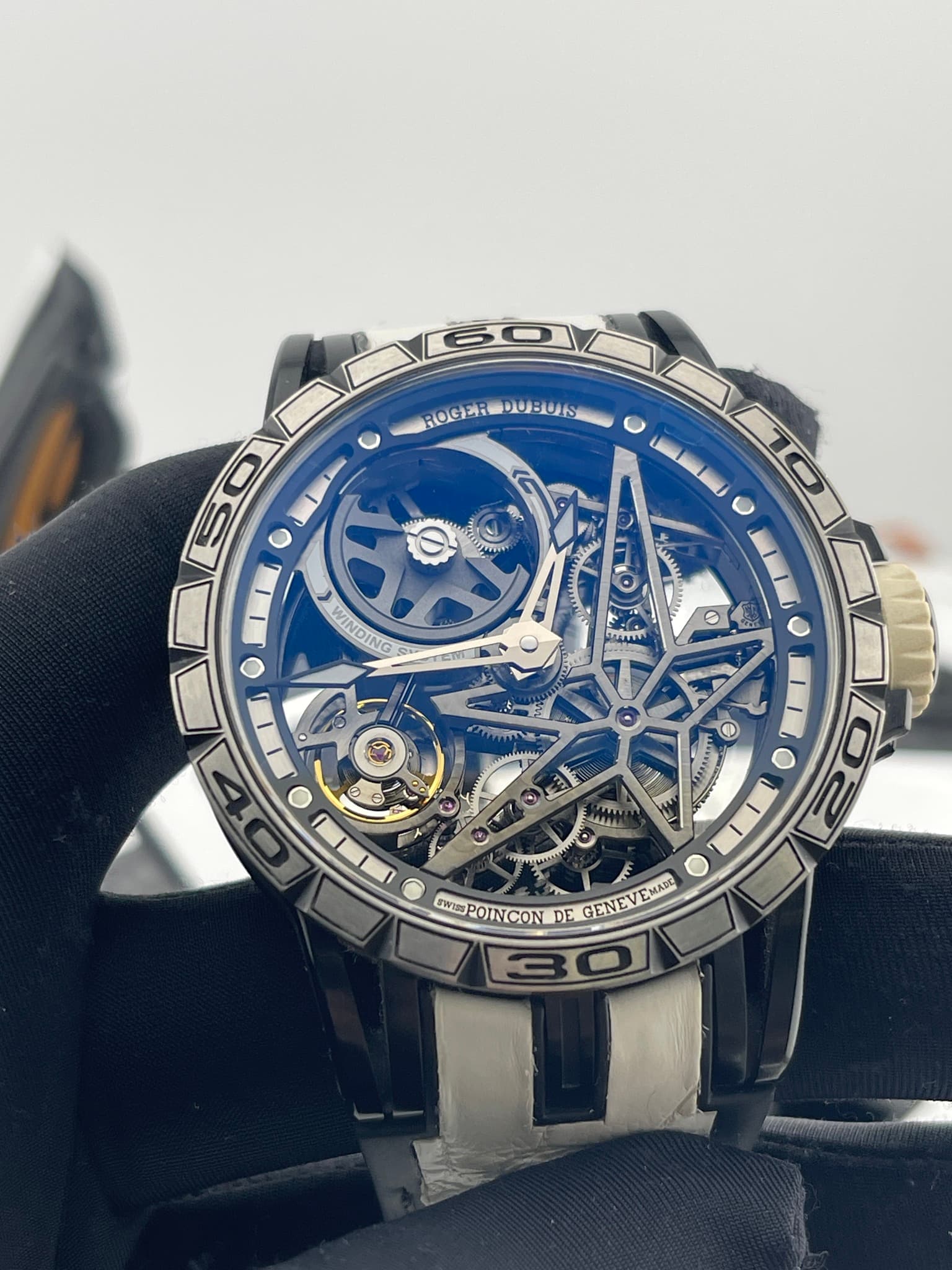 May be an image of wrist watch and text