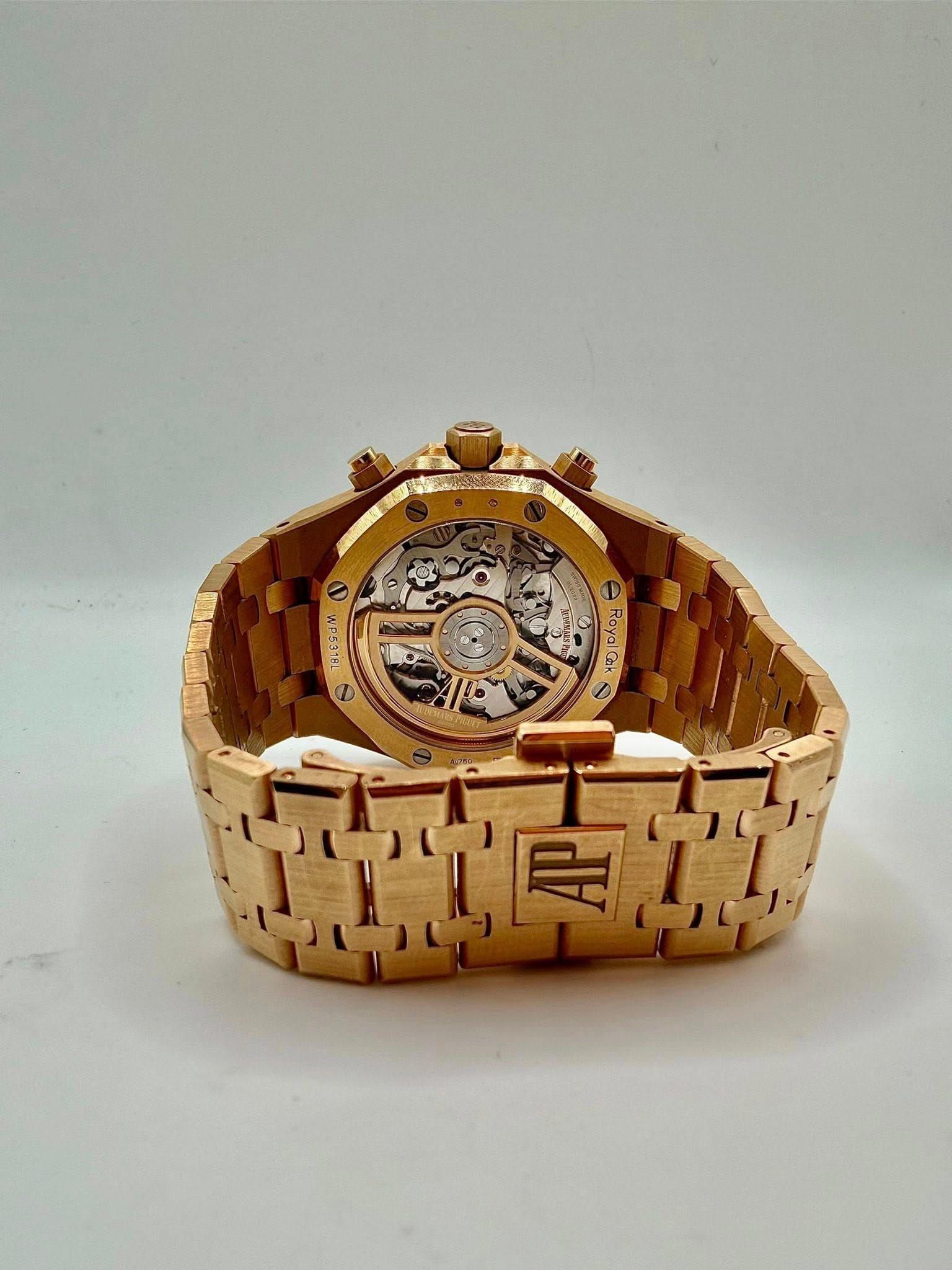 May be an image of brass, wrist watch and text