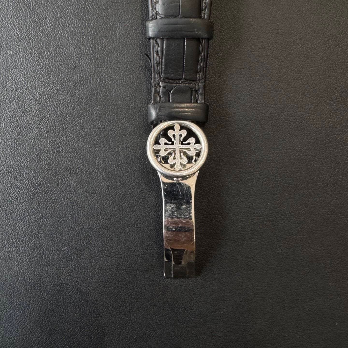 May be an image of wrist watch and leather