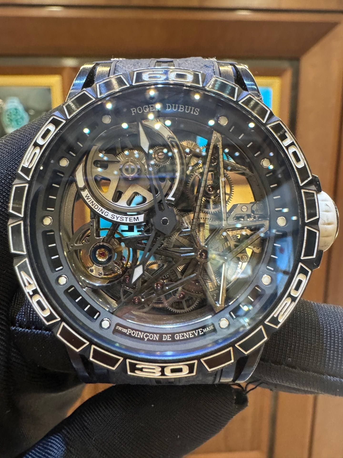 May be an image of wrist watch and text