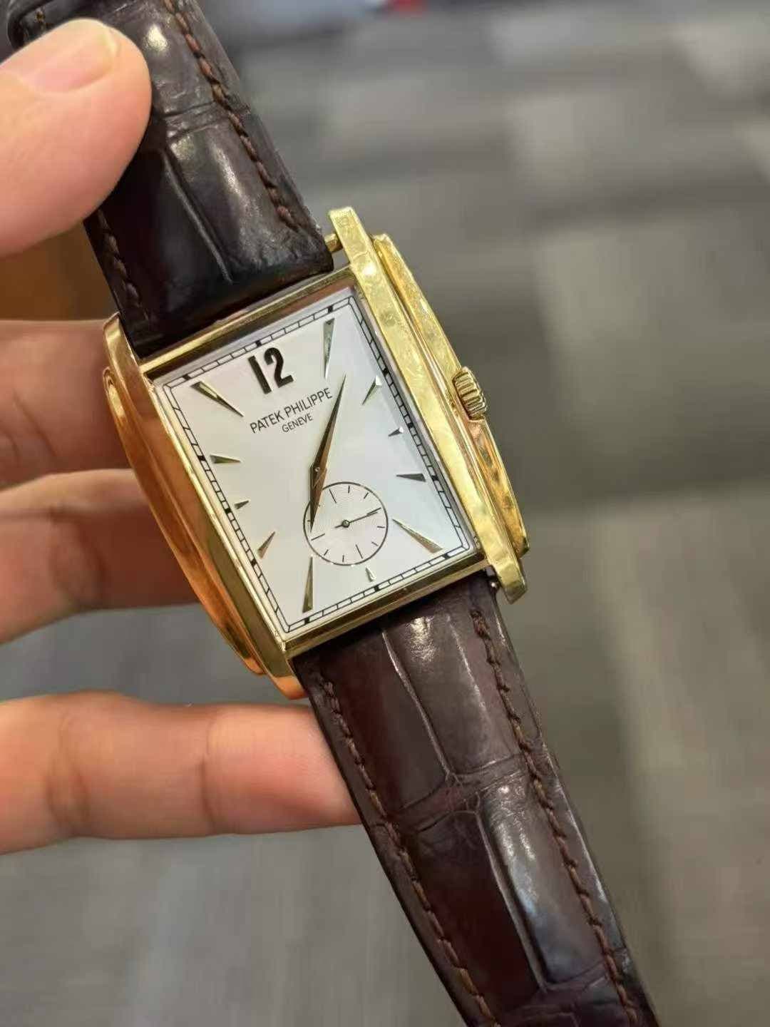 May be an image of wrist watch and text that says '၅) 12 PATEKPHILIPPE PATEK GENEVE PHILIPPE / ١'