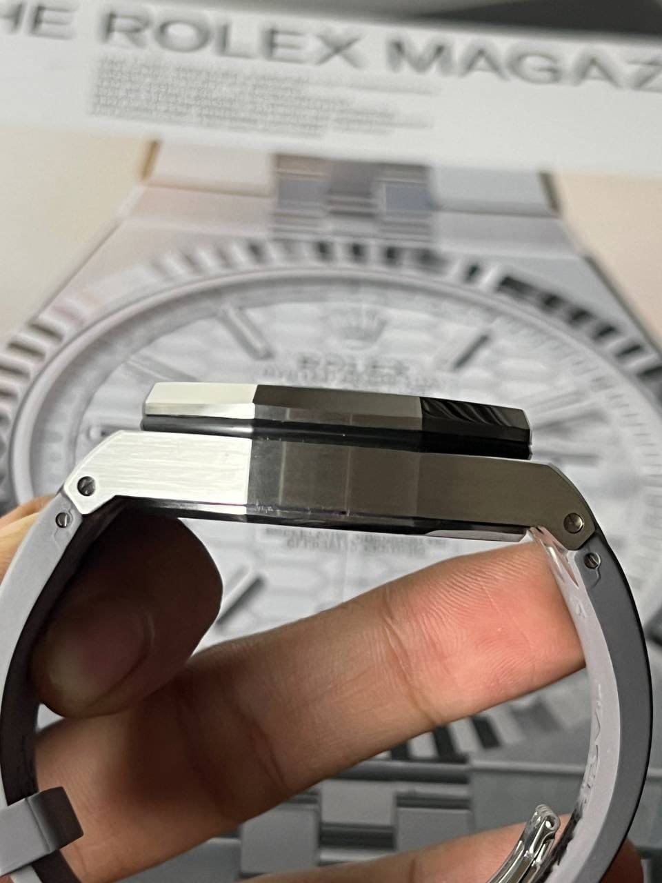 May be an image of wrist watch and text