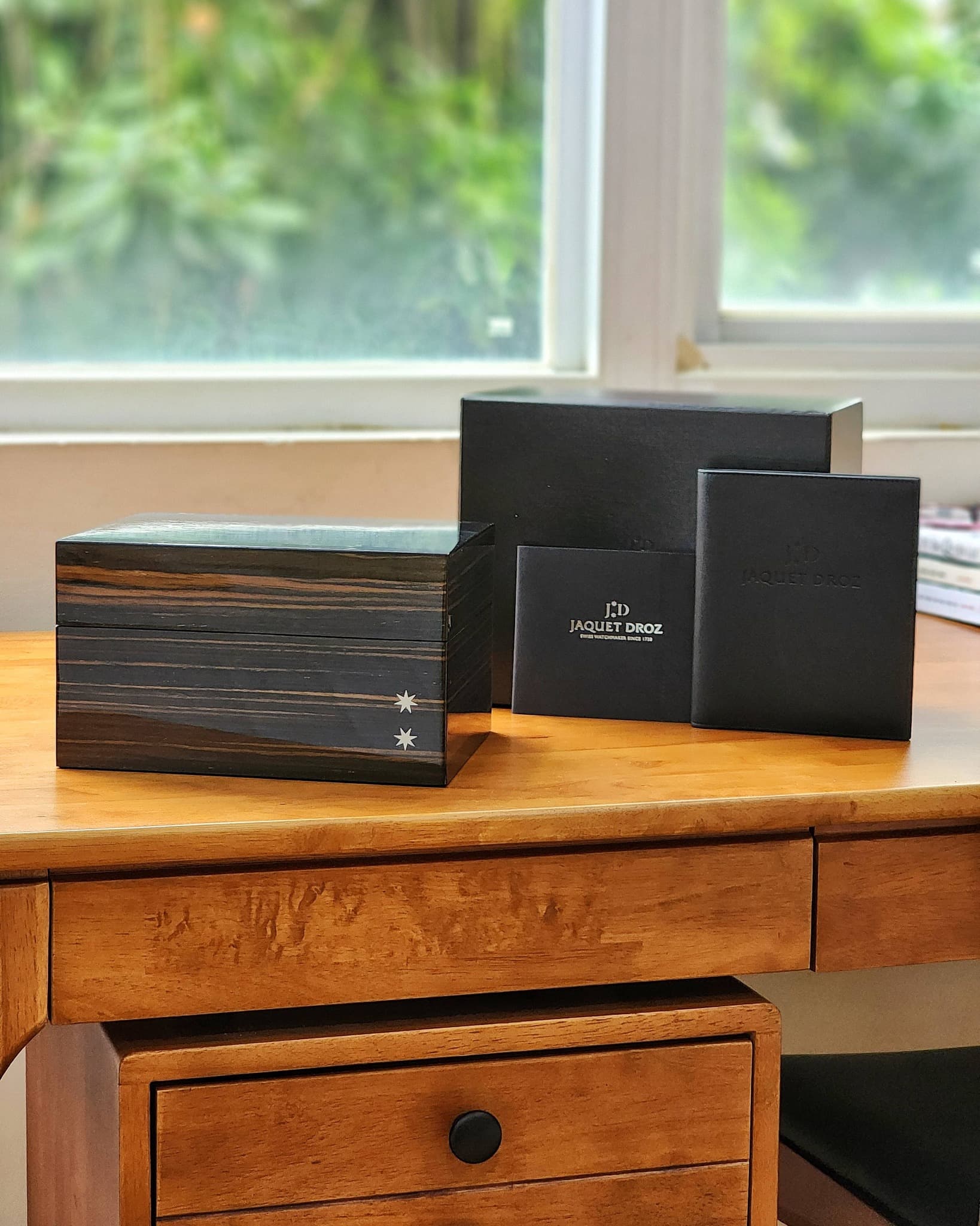 May be an image of leather wallet, saddle-stitched leather and book