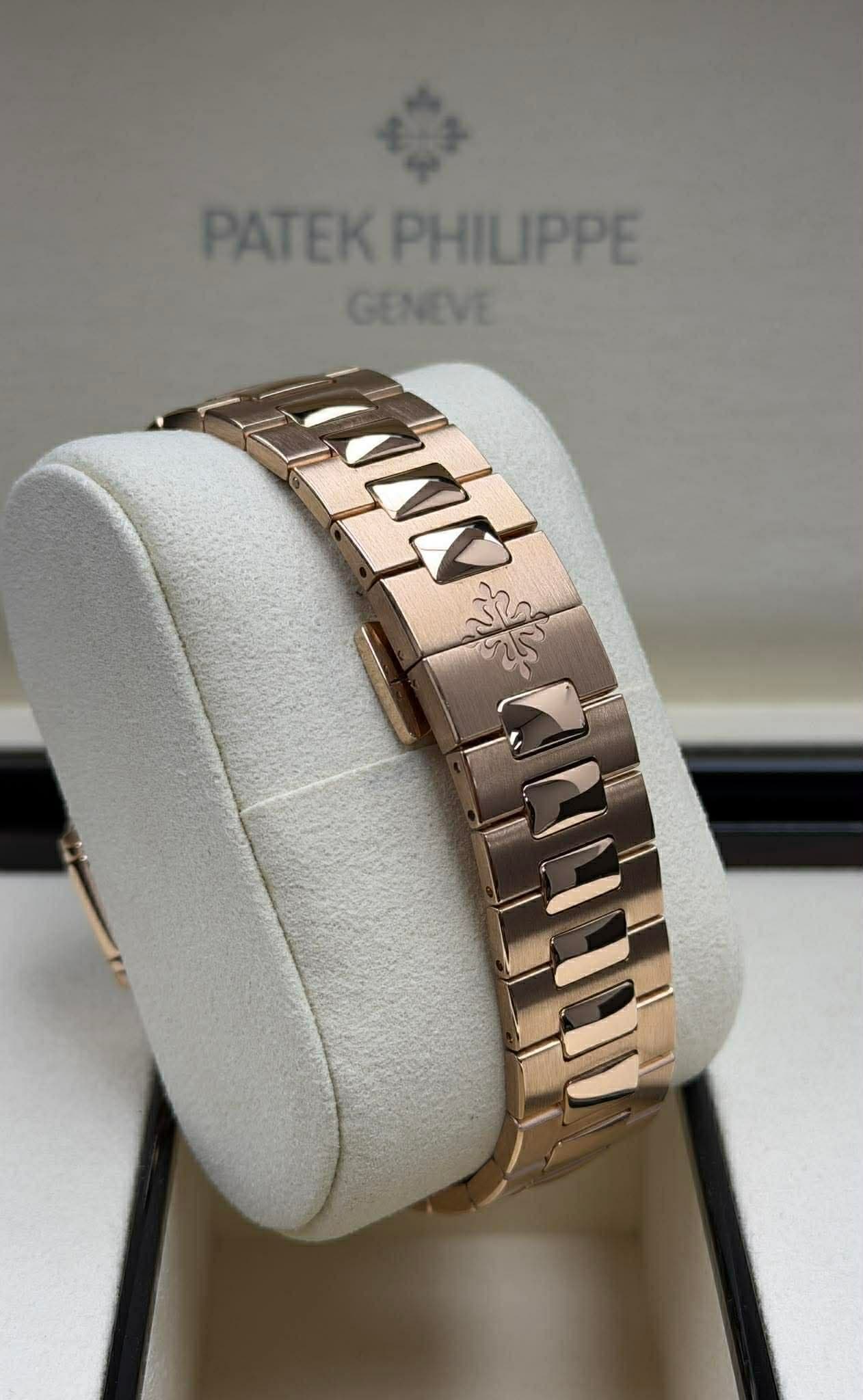 May be an image of wrist watch, jewelry and text that says 'PATEK PHILIPPE GENEVE'
