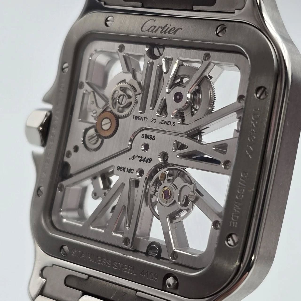 May be an image of wrist watch and text that says 'eCartier e Cartier mi m TWENTY 20 JEWELS = SWISS N2449 9611 9611MC'