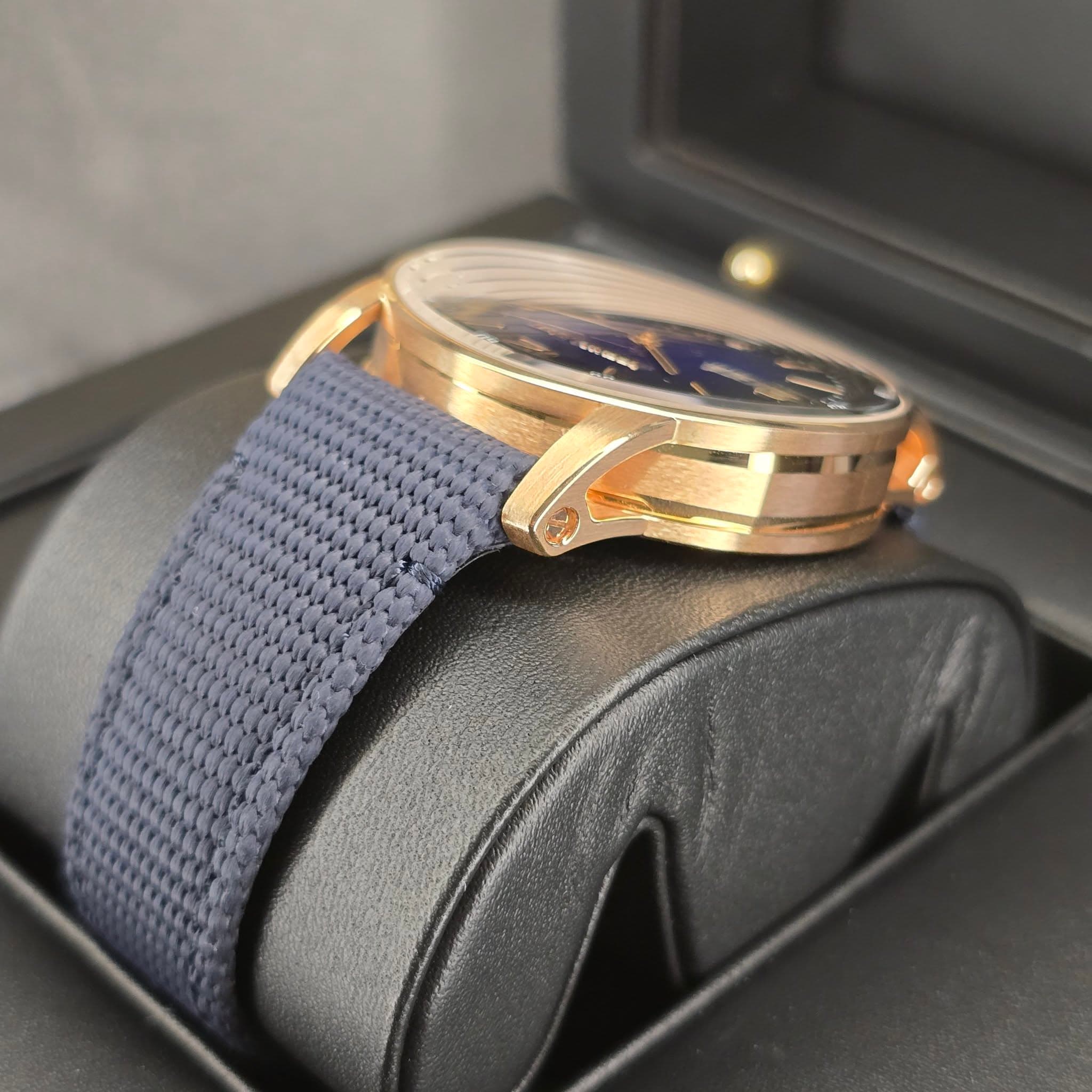 May be an image of wrist watch and text