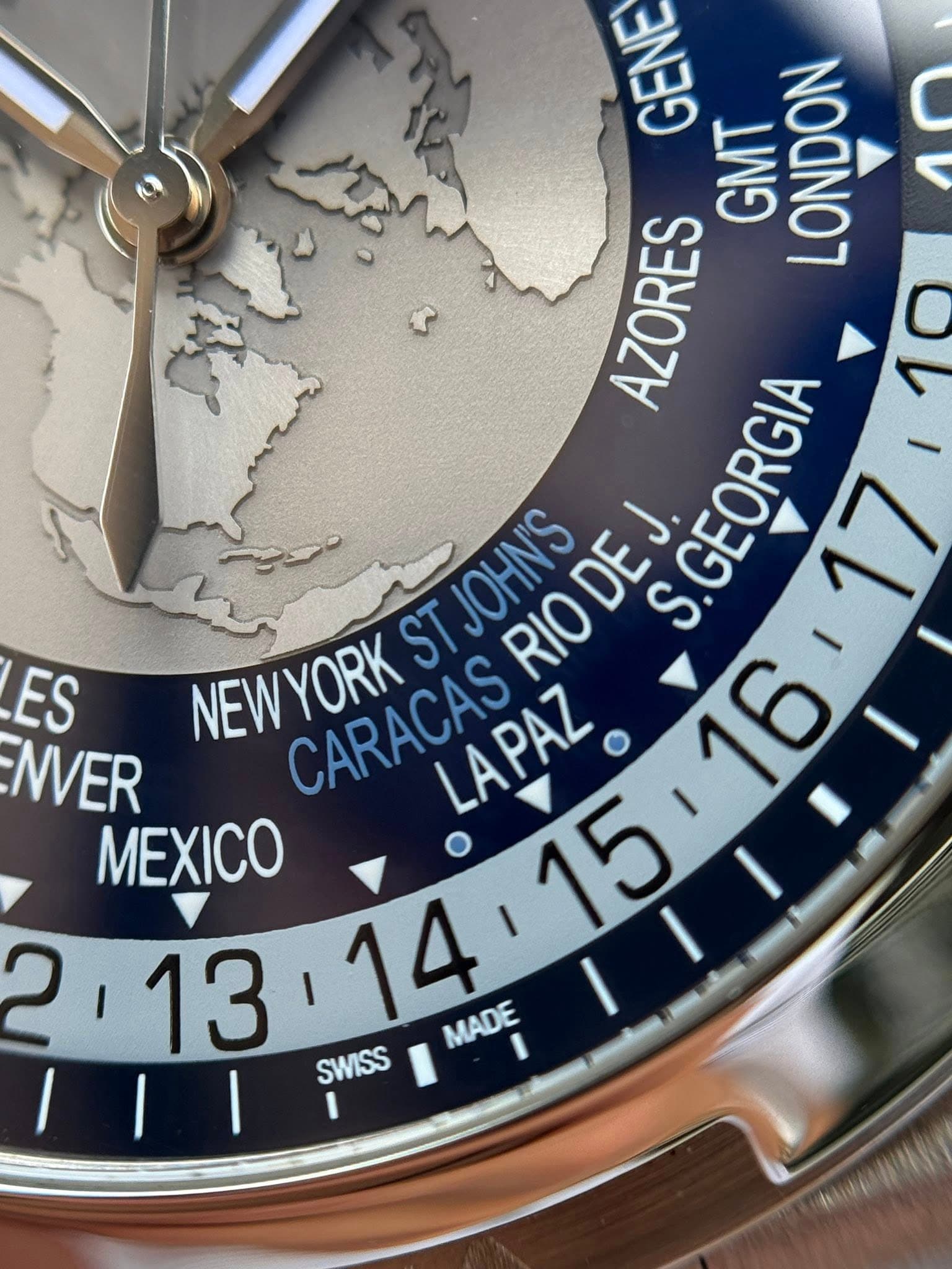 May be an image of wrist watch, map and text that says 'GENE GMT LONDON AZORES 10 JOHN'S ES NEWYORK ST RIO DEJ. S.GEORGIA NVER CARACAS CARACAS LAPAZ MEXICO 213 13 SWISS MADE MADE'
