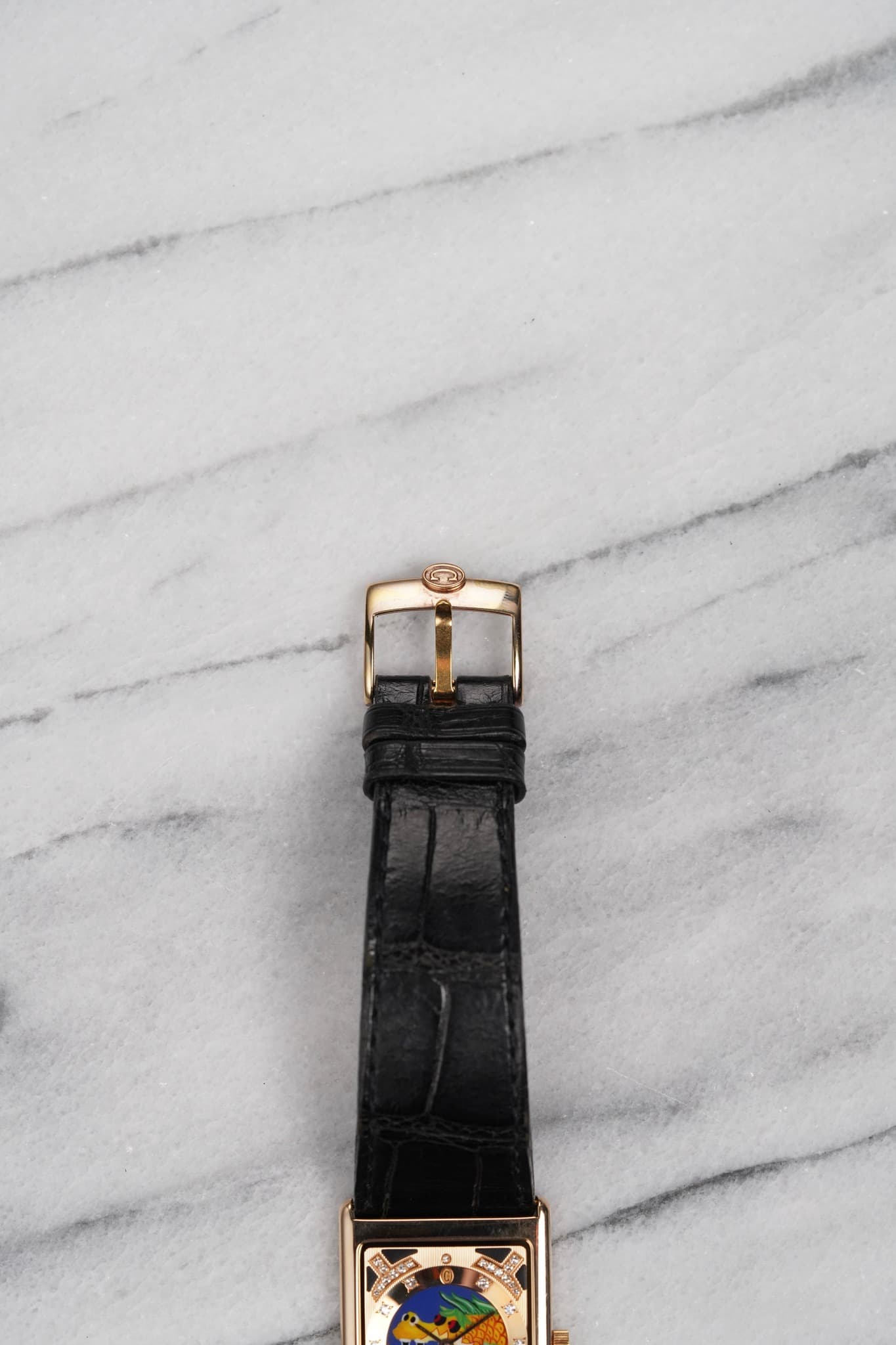 May be an image of wrist watch and text