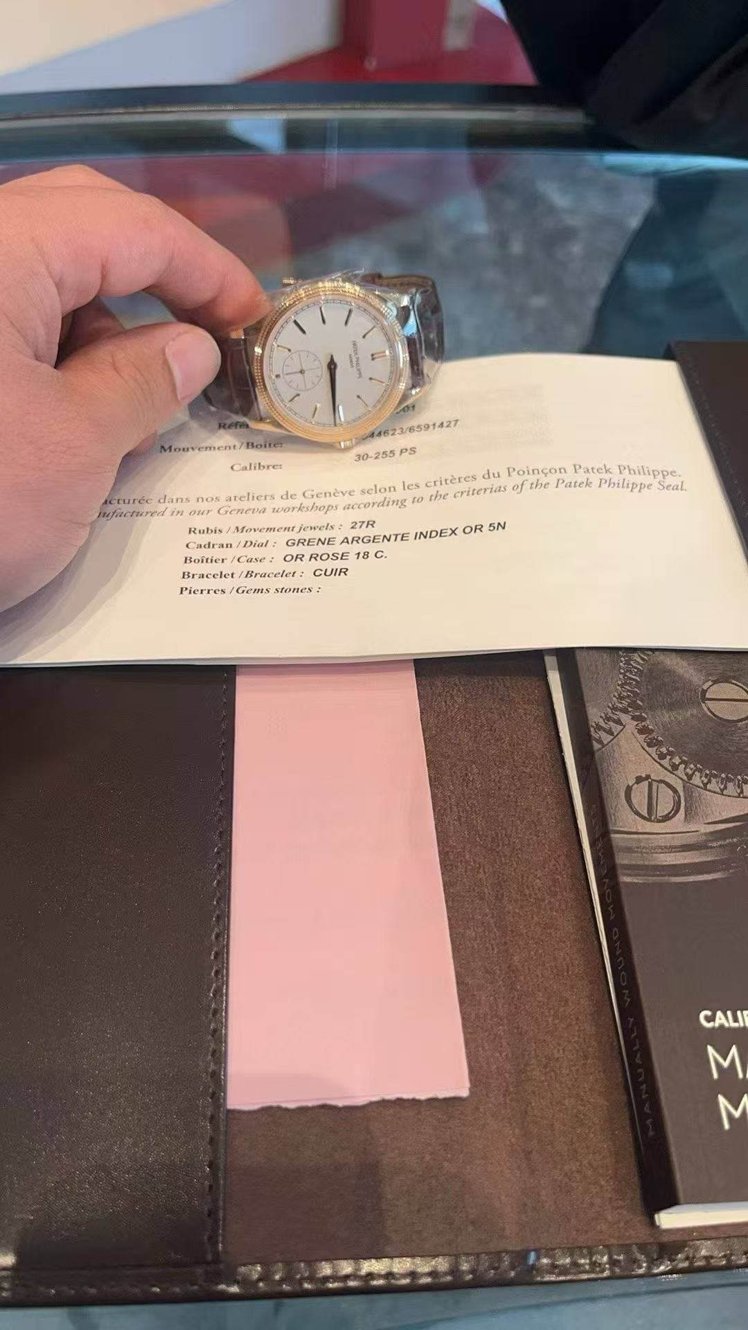 May be an image of wrist watch and text