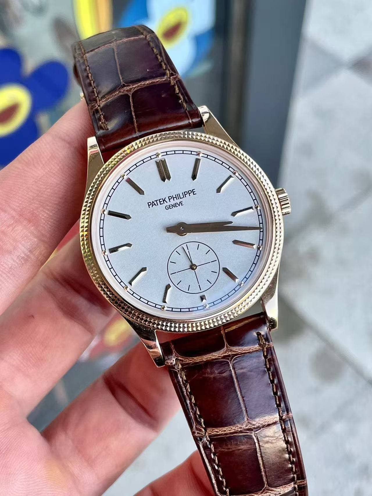 May be an image of wrist watch and text that says 'PATEK PHILIPPE GENEVE I'