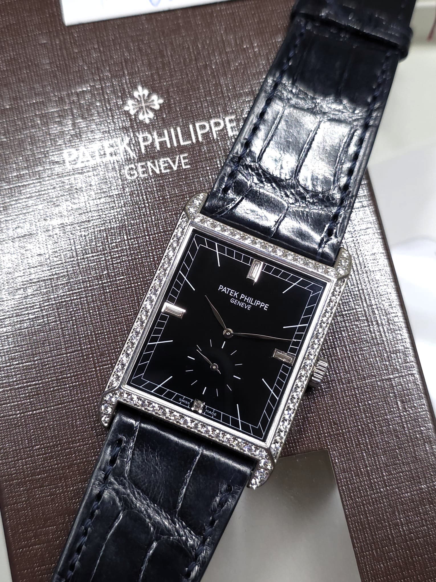 May be an image of wrist watch and text