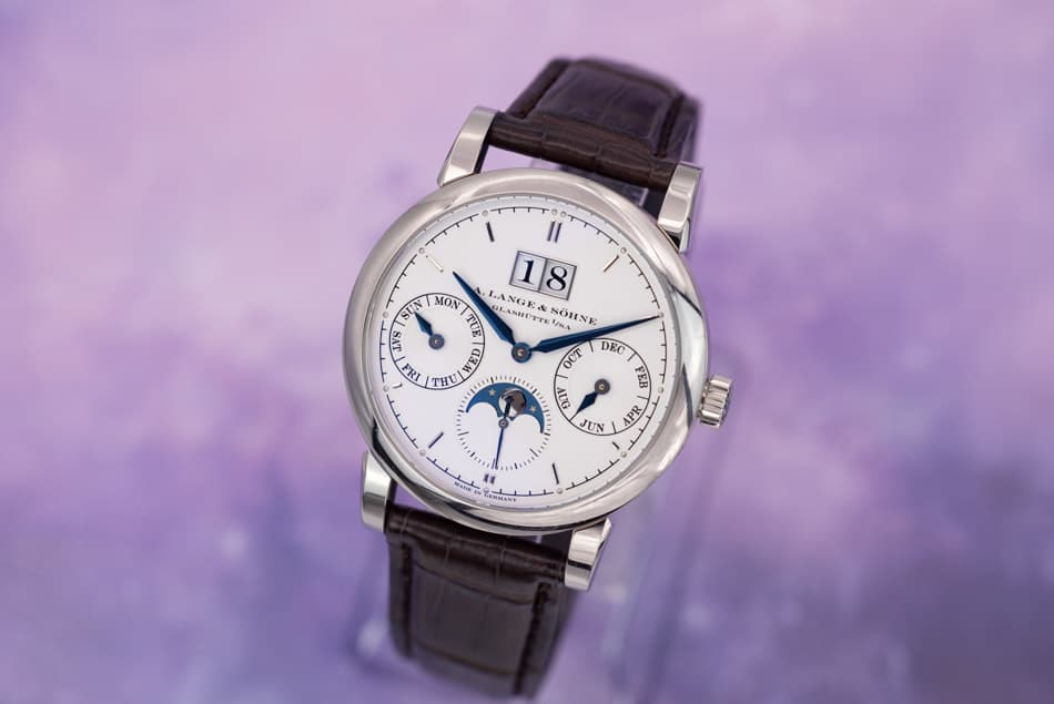May be an image of wrist watch and text that says '١ Il SUN MON LANGE& GLANBETTI ያድእ NOINE INA 18 TU SNS ਸੇਜ τΗυ WEL JE UIM OCT DKC FEB IP JUN APR သး 1'