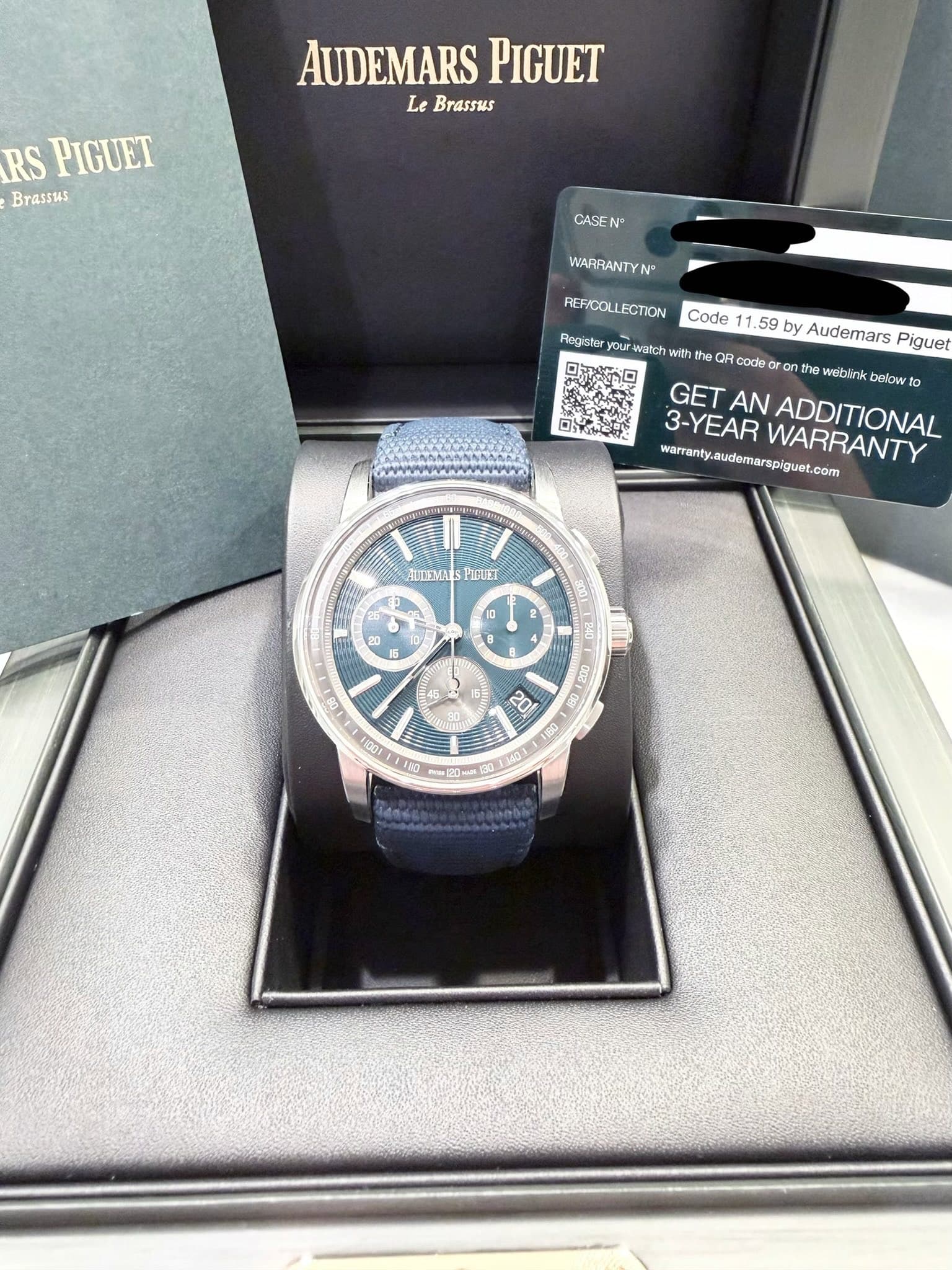 May be an image of wrist watch and text that says 'AUDEMARS PIGUET Le Brassus RS PIGUET Brassus CASEN WARRANTYN REF/COLLECTION Code by Audemars Piguet Register your watch 動 O OF…