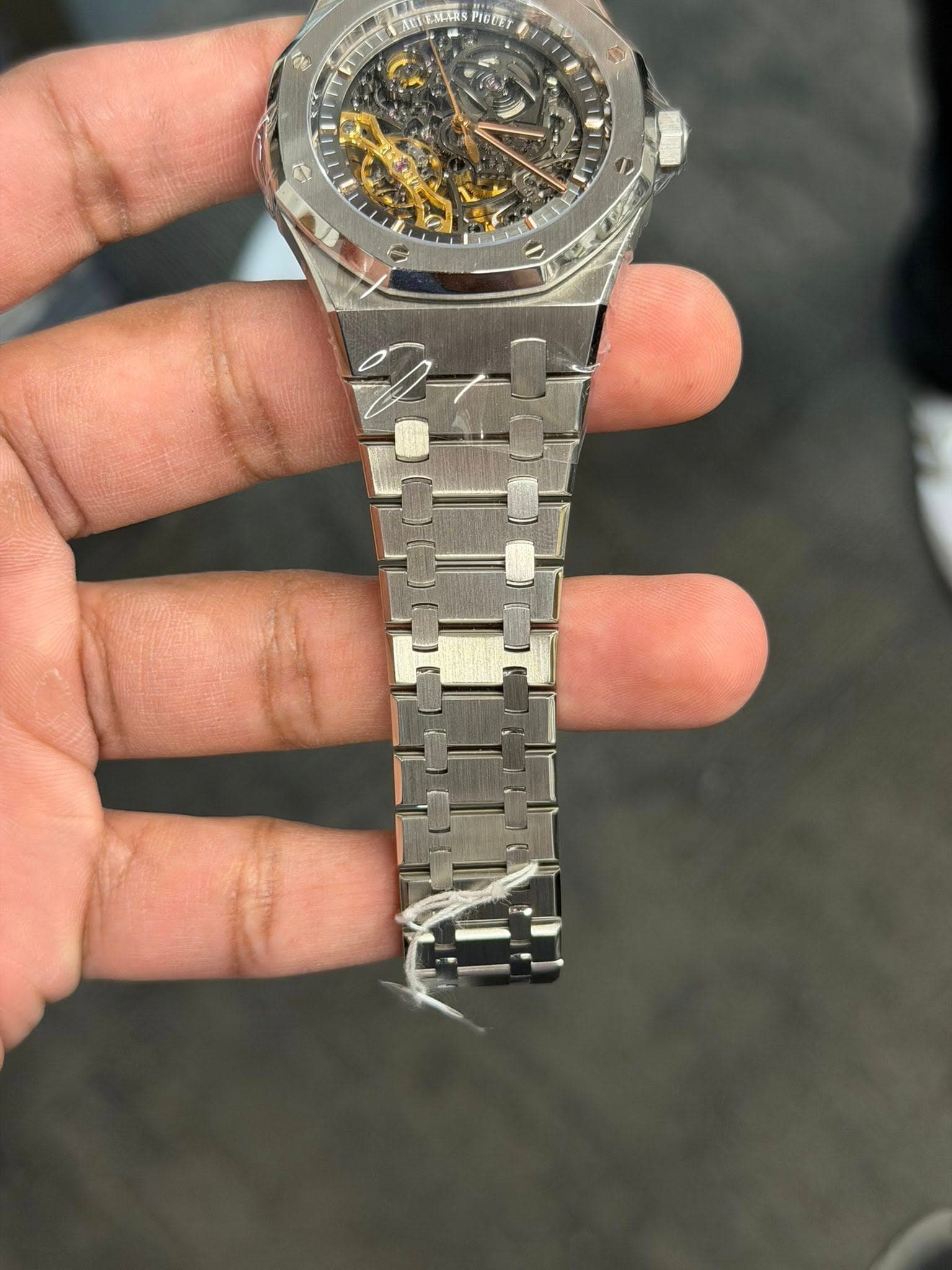 May be an image of wrist watch and text