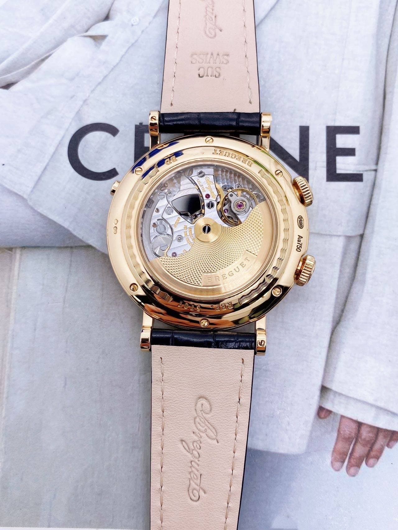 May be an image of wrist watch and text