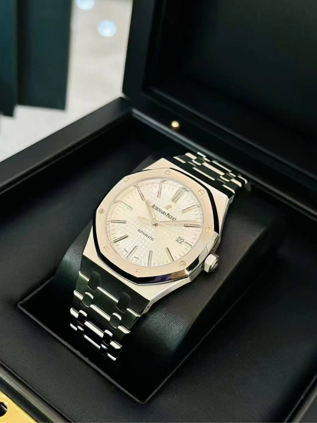 May be an image of wrist watch and text