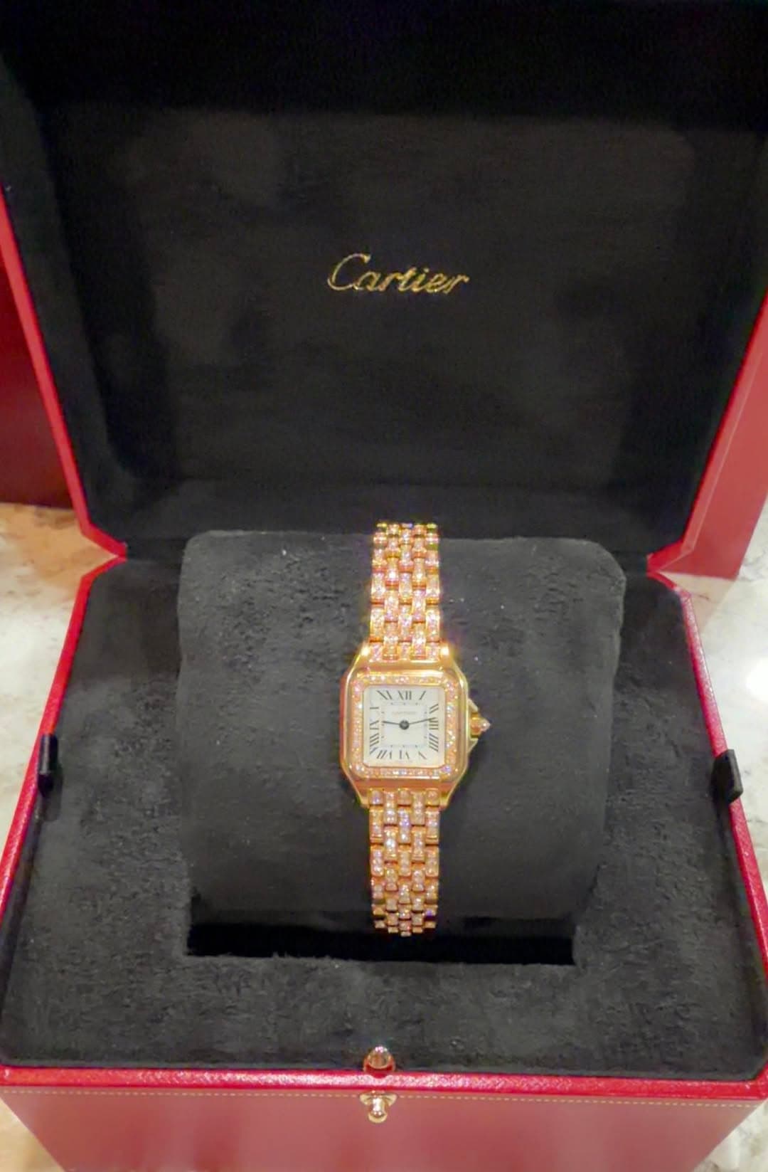 May be an image of wrist watch and text that says 'Cartier ١ II'