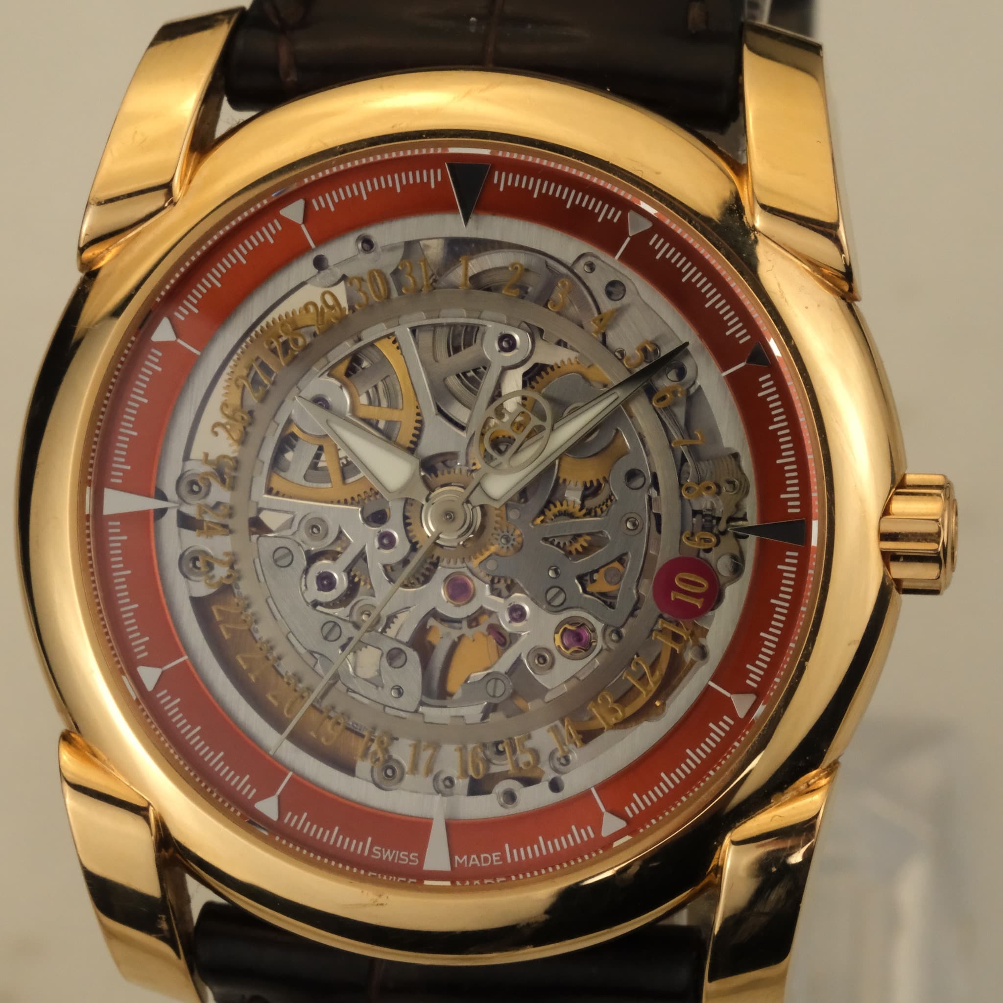 May be an image of wrist watch and text