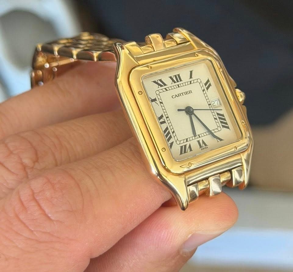 May be an image of wrist watch and text